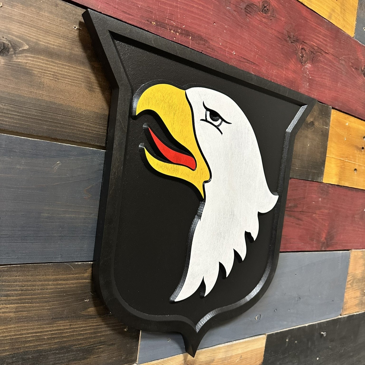 Side profile of 101st Airborne Division Screaming Eagles carved wood patch wall sign showing thickness