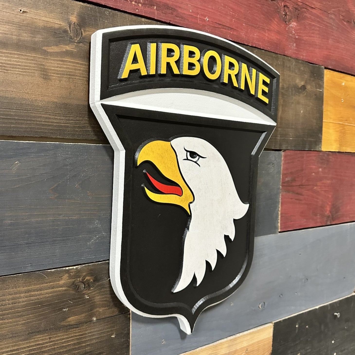 Side profile of 101st Airborne Division Screaming Eagles carved wood wall sign showing thickness