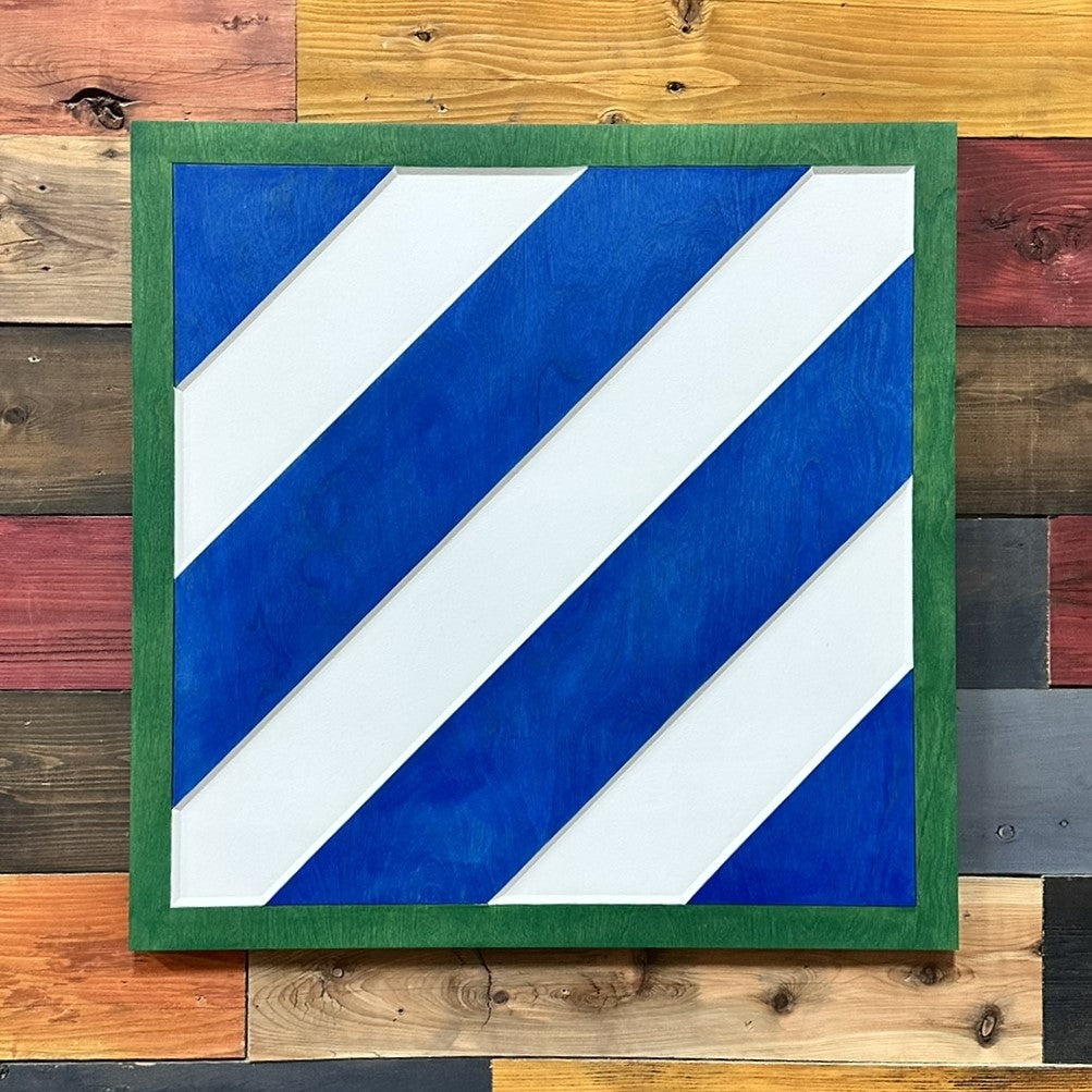 Close up detail of 3rd Infantry Division carved wood sign showing dimensional diagonal stripes
