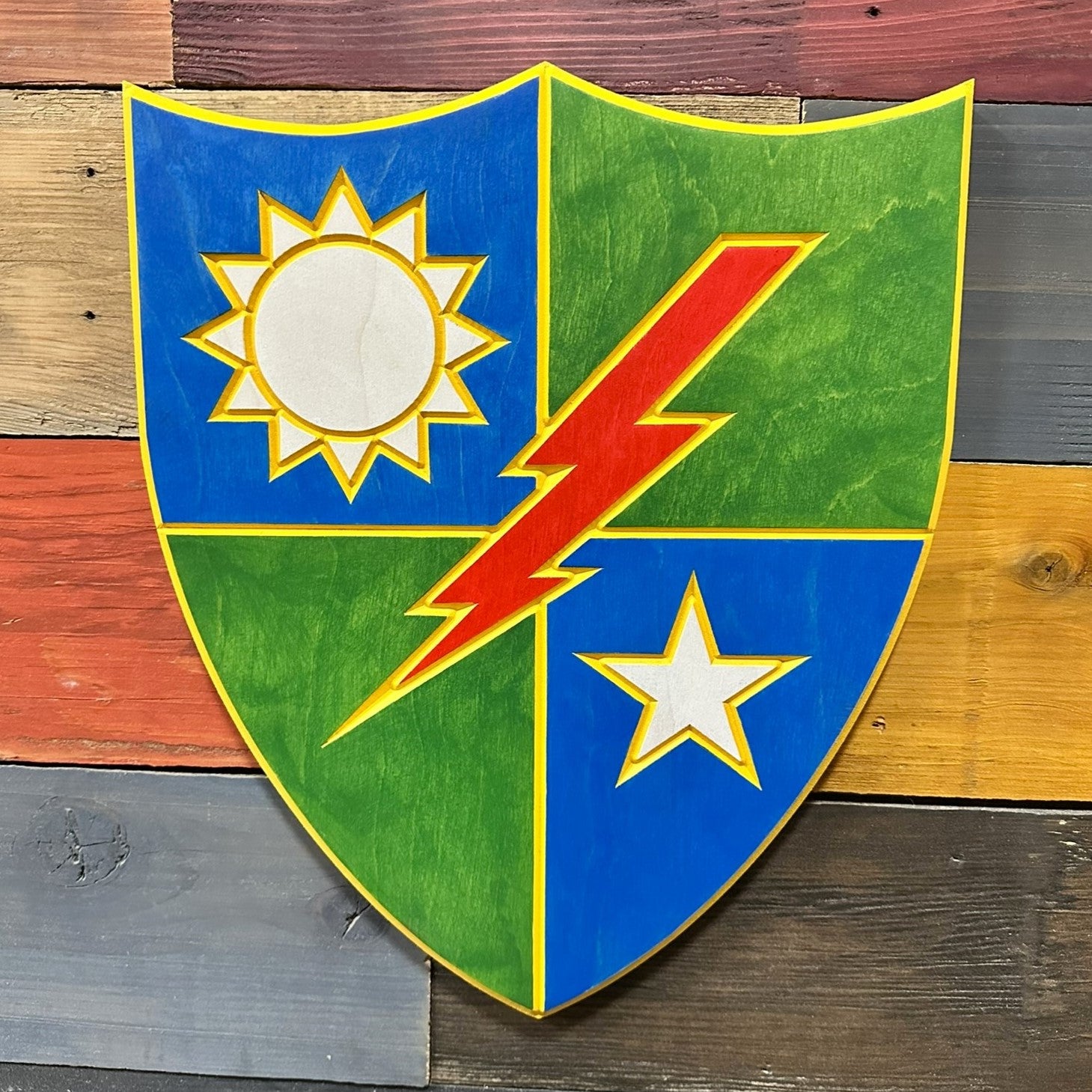 Close up detail of 75th Ranger Regiment carved wood sign showing red lightning bolt and shield