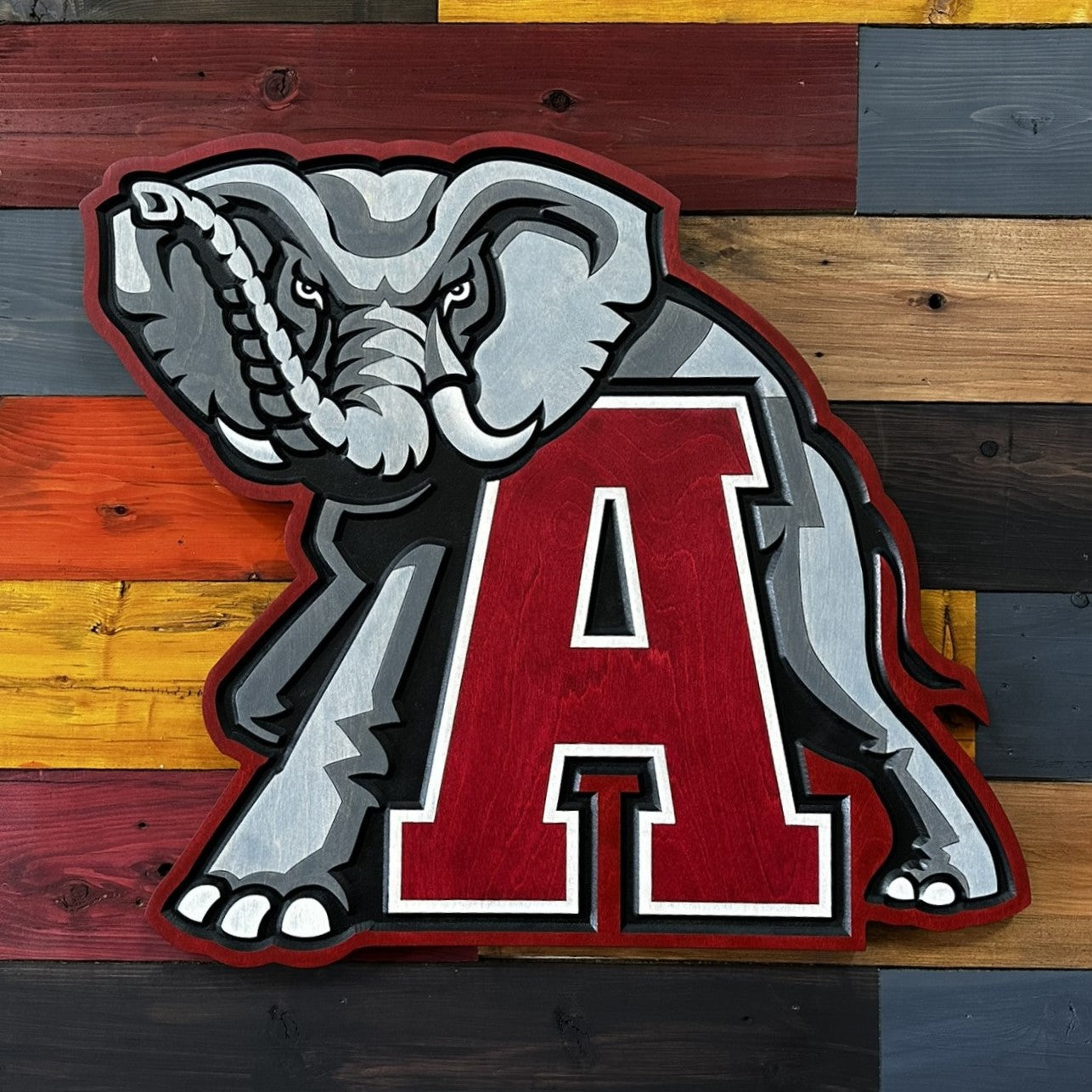 Close-up of carved Alabama Crimson A elephant wood sign detail