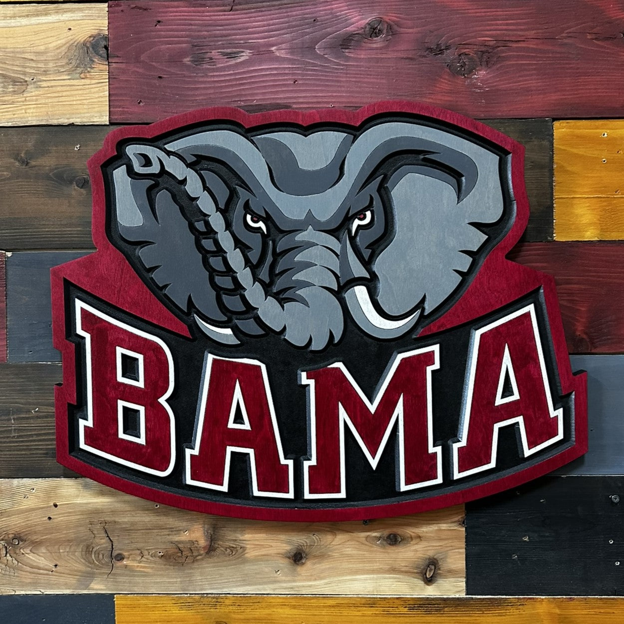 Close-up of carved Alabama Big Al BAMA wood sign detail