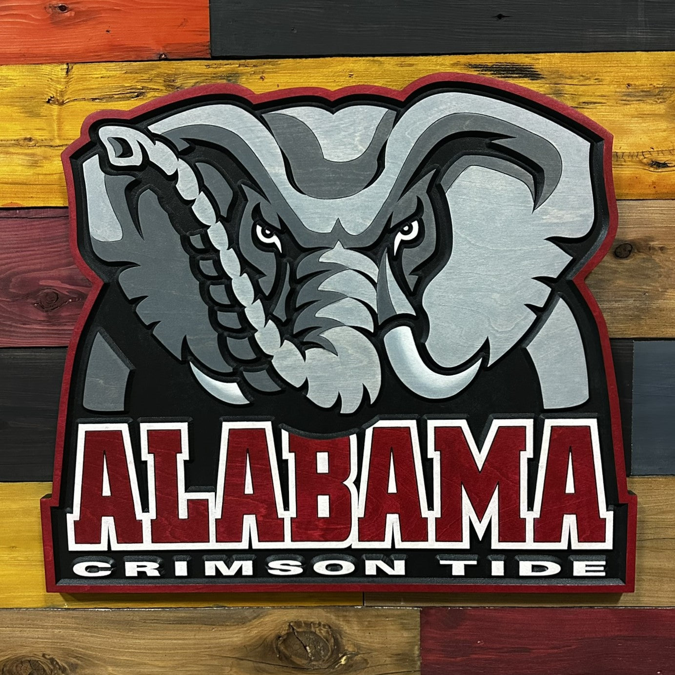 Close-up of carved Alabama Crimson Tide elephant head logo wood sign