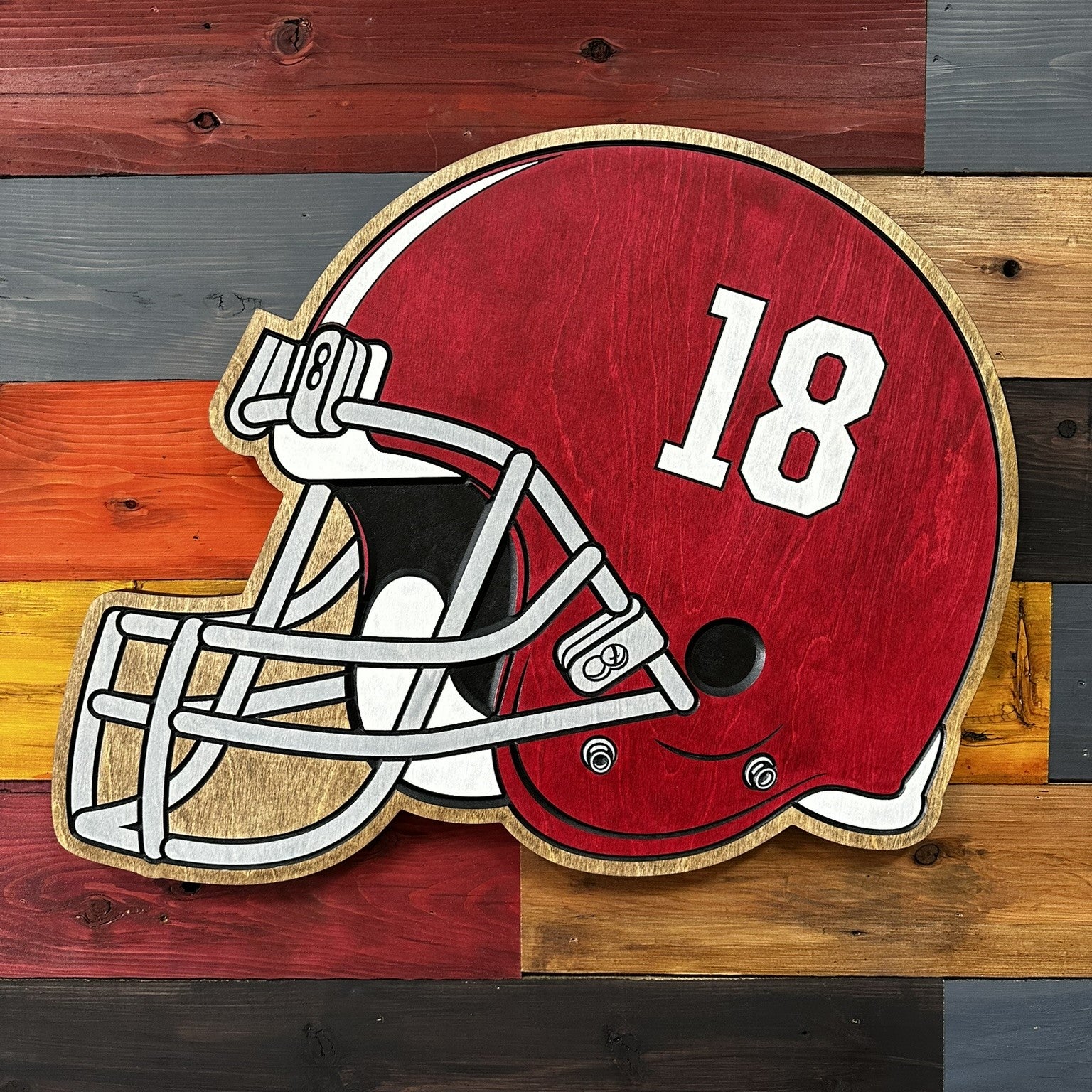 Close-up of carved Alabama Crimson Tide helmet wood sign detail
