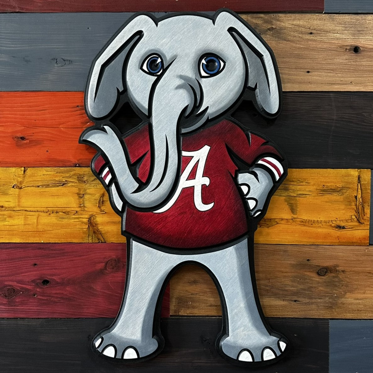 Close-up of carved Big Al Alabama mascot wood sign detail