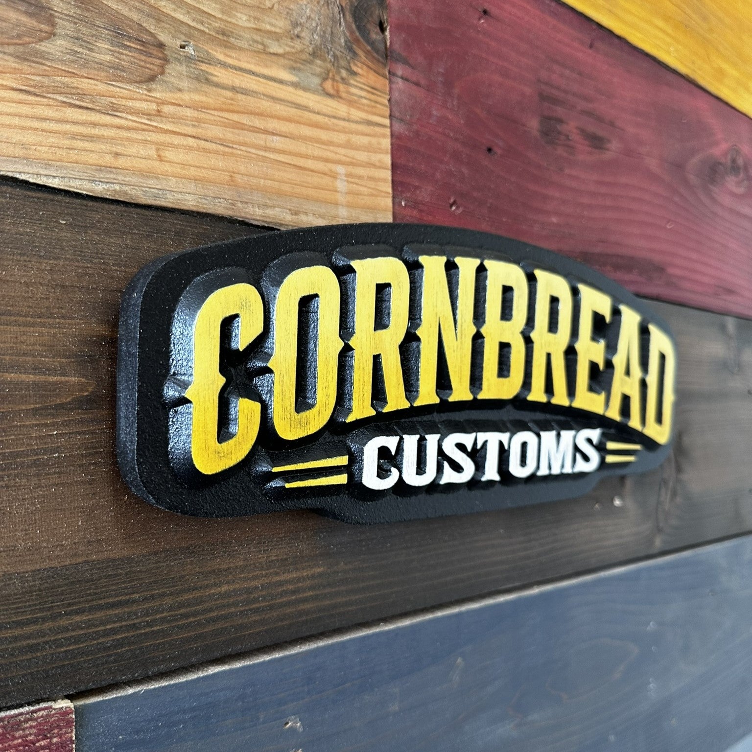 Cornbread Customs arched yellow logo handcrafted wood wall sign