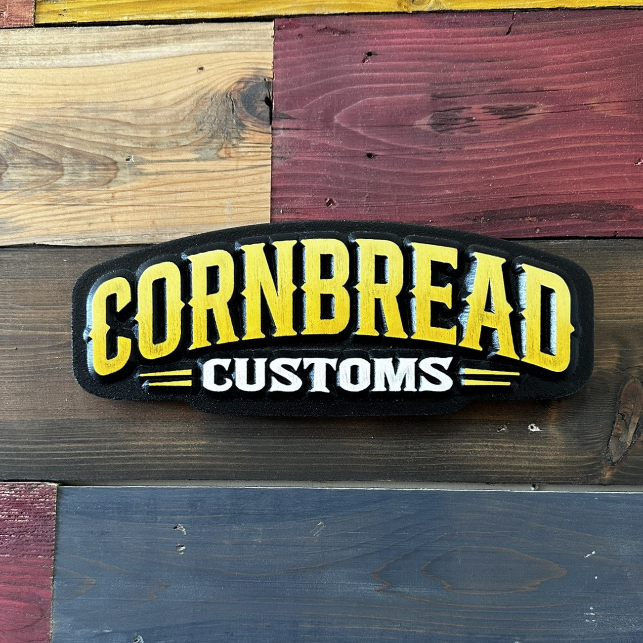 Handcrafted Cornbread Customs yellow and black carved logo wood sign
