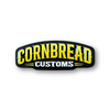 Cornbread Customs yellow logo wood sign with arched yellow lettering and white Customs text on white background