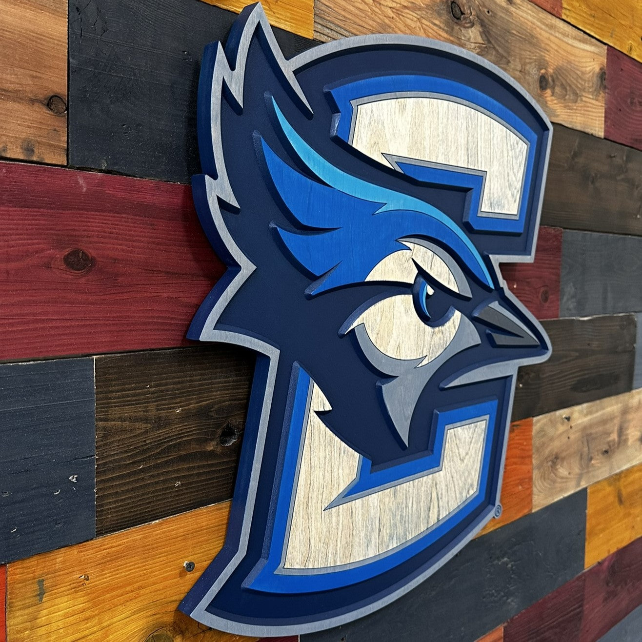 Angled view of Creighton Bluejays 3D wood wall sign