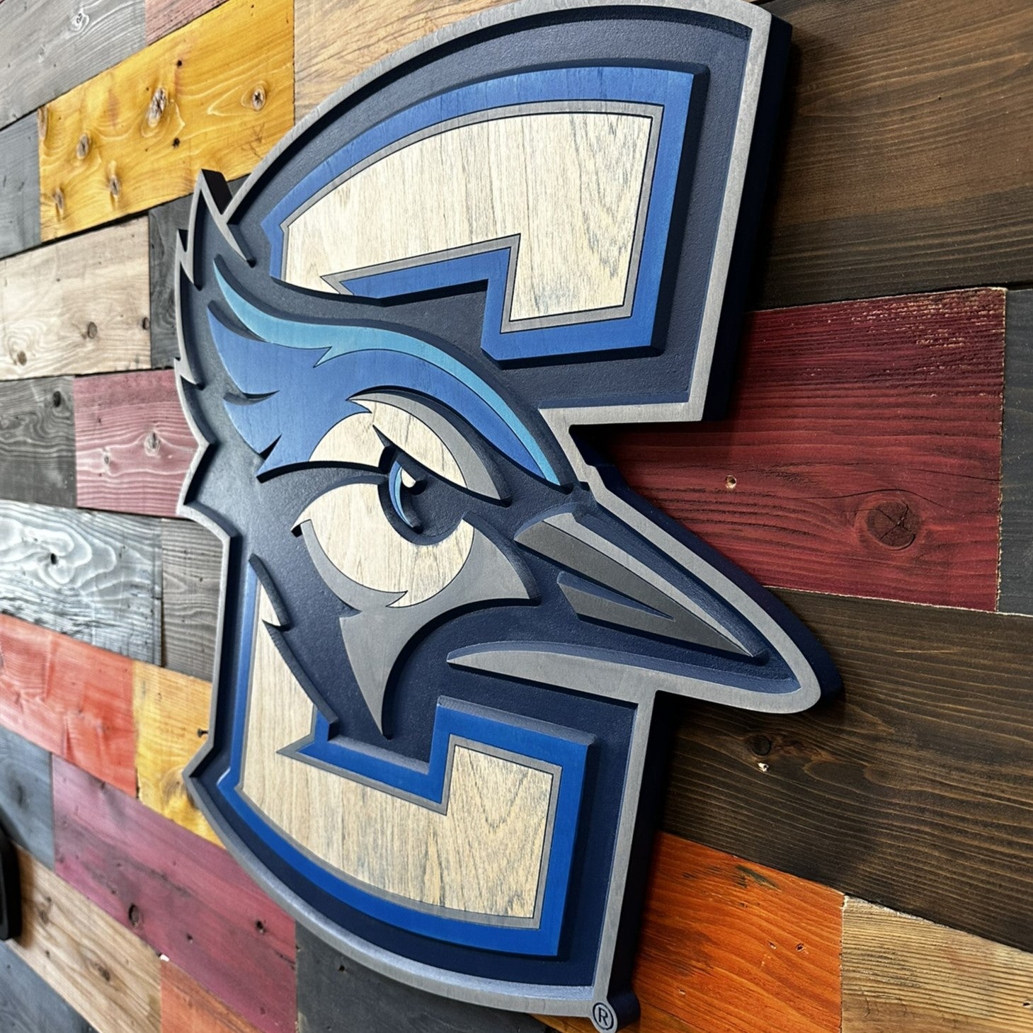 Side profile of Creighton Bluejays 3D wood wall sign