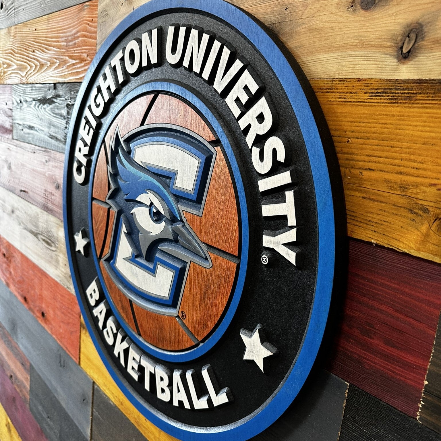 Detail view of carved Creighton Bluejays basketball design