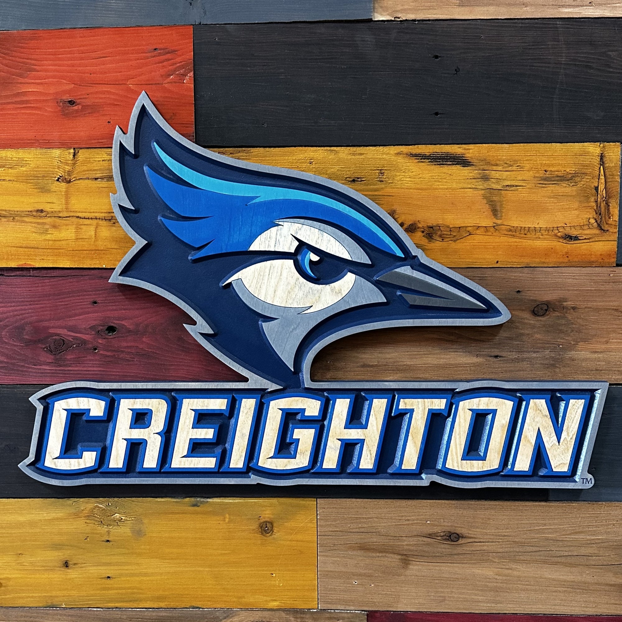 Close-up of carved Creighton Bluejays Billy wood sign detail