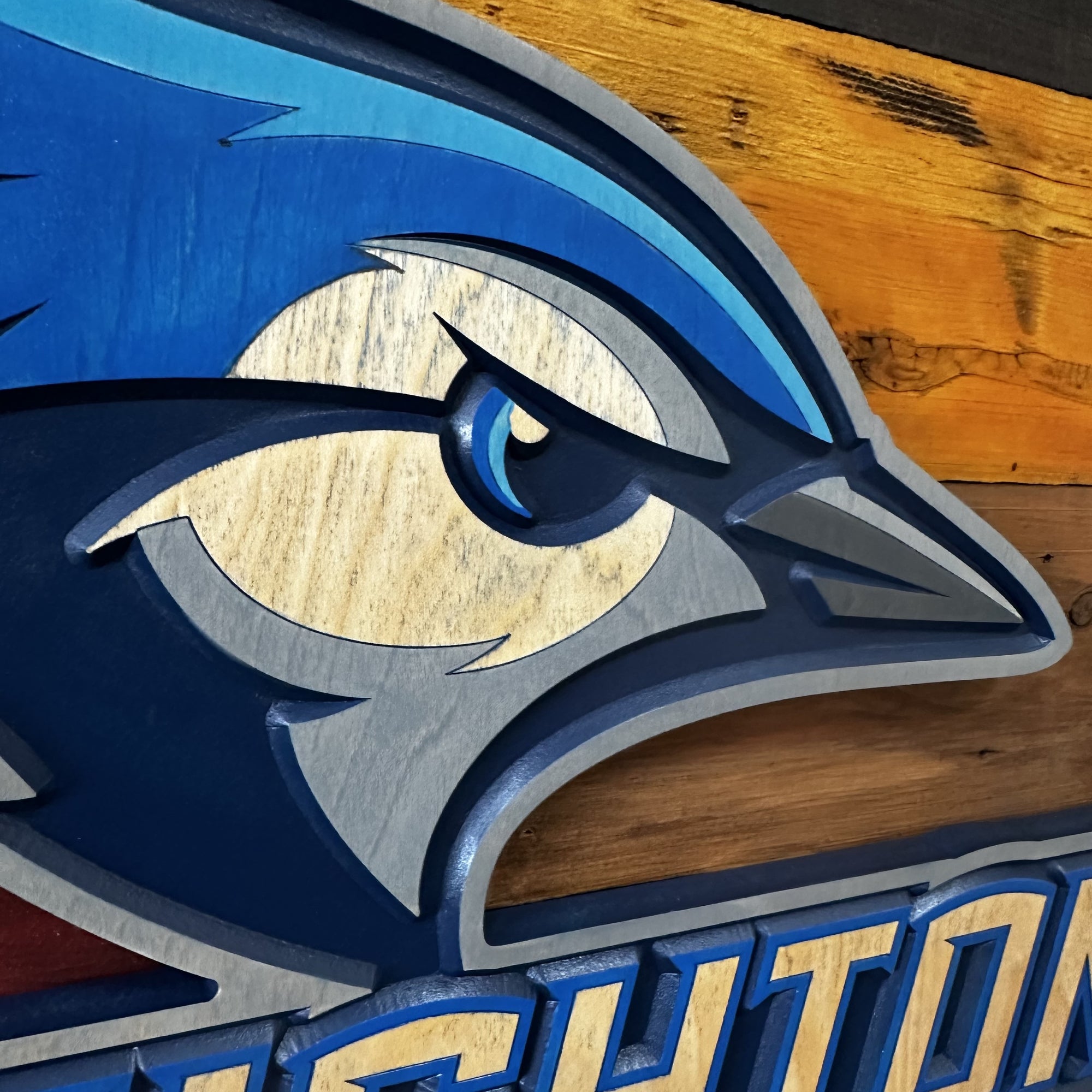 Side profile of Creighton Bluejays Billy wood sign