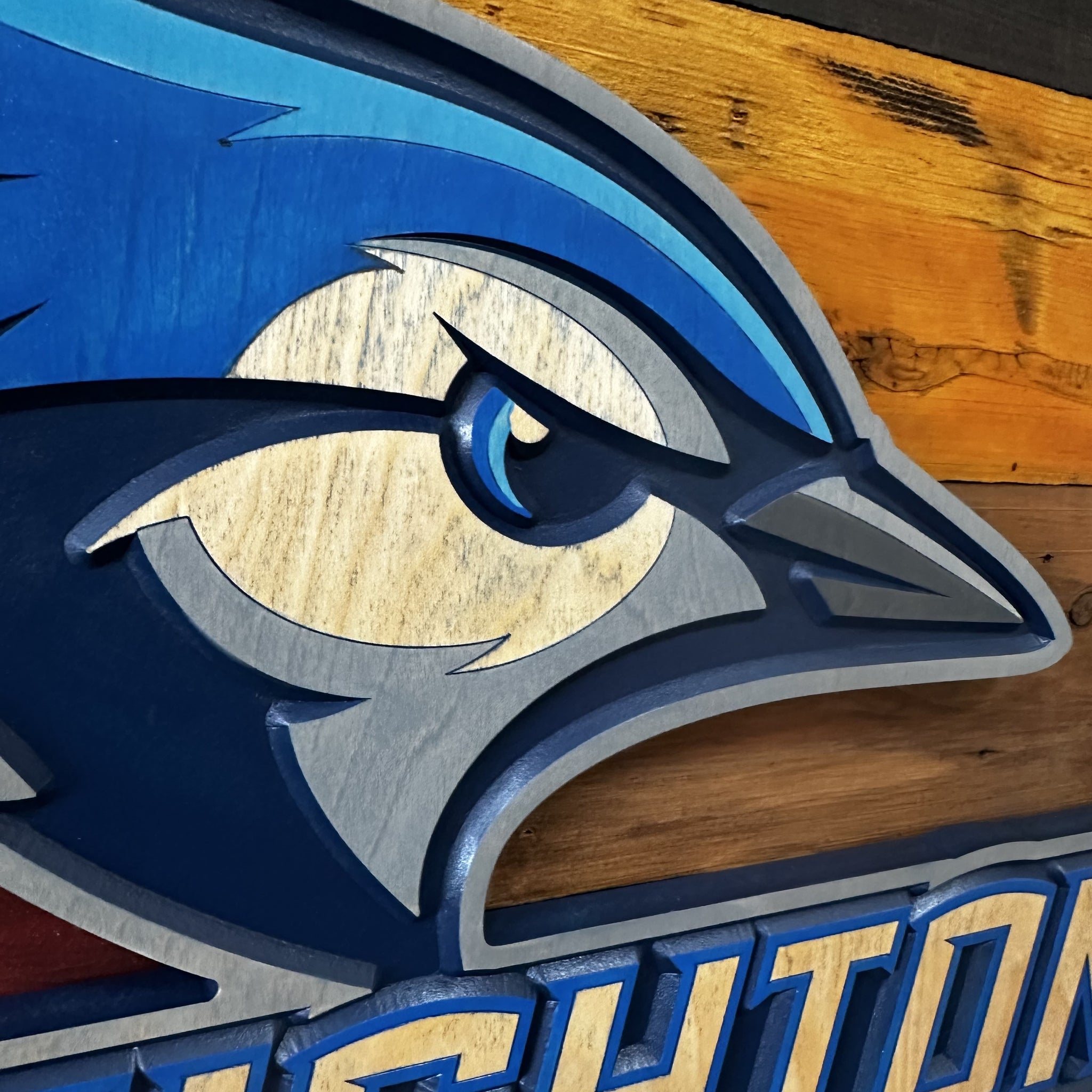Side profile of Creighton Bluejays Billy wood sign