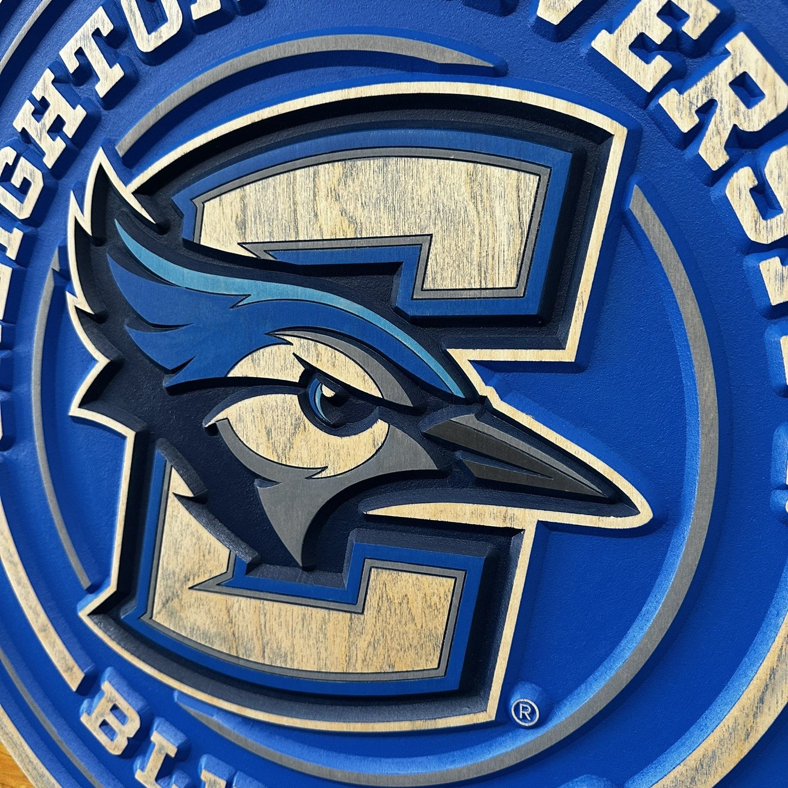 Creighton Bluejays round full logo wood sign displayed on wall