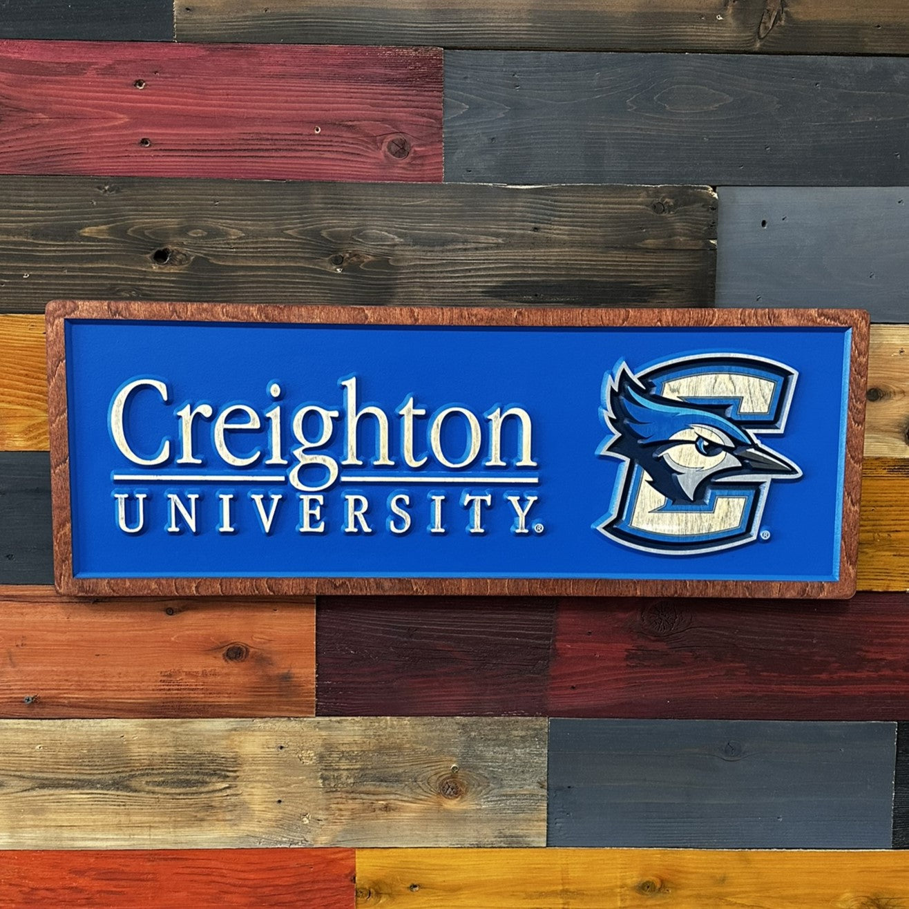 Close-up of Creighton University horizontal wood sign detail