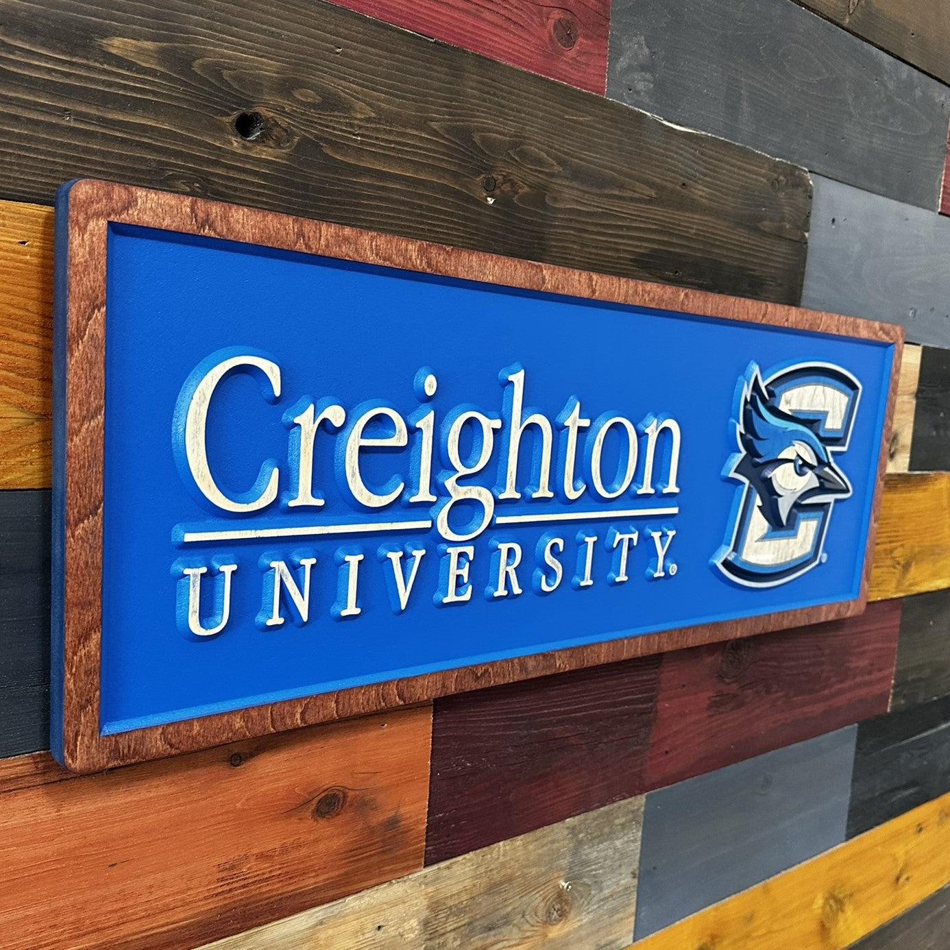 Creighton University horizontal wood sign displayed on wall