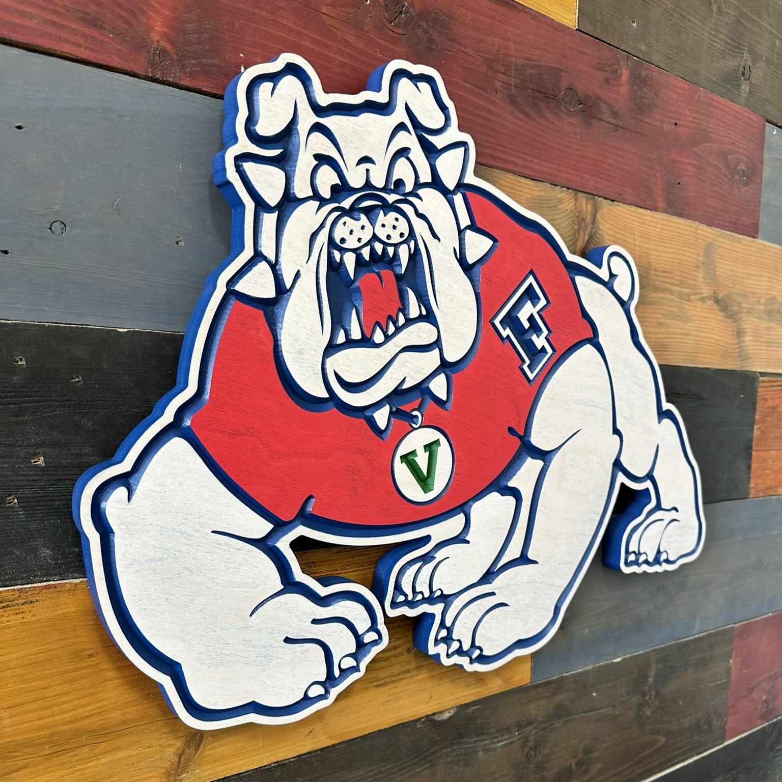 Close view of Fresno State Victor E. Bulldog carved wood sign