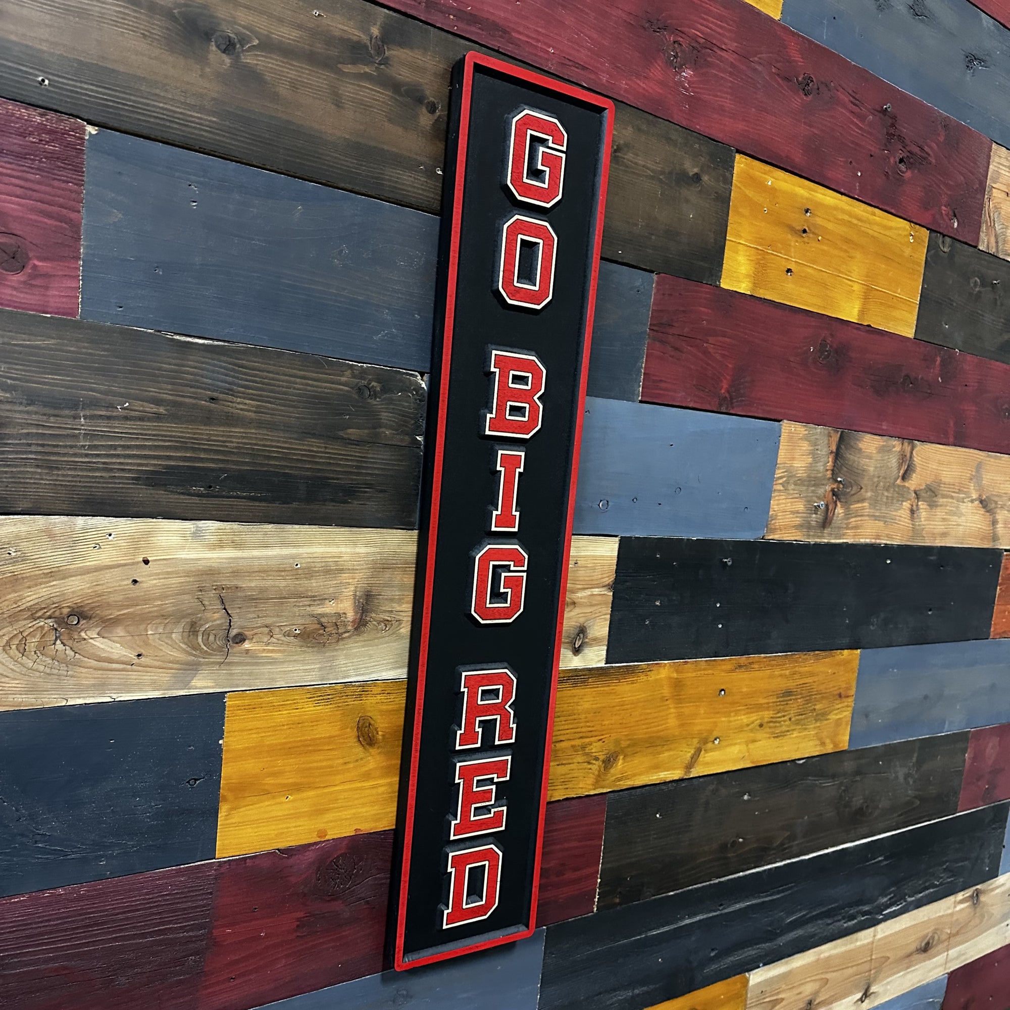 Angled view of Go Big Red Husker sports wood sign