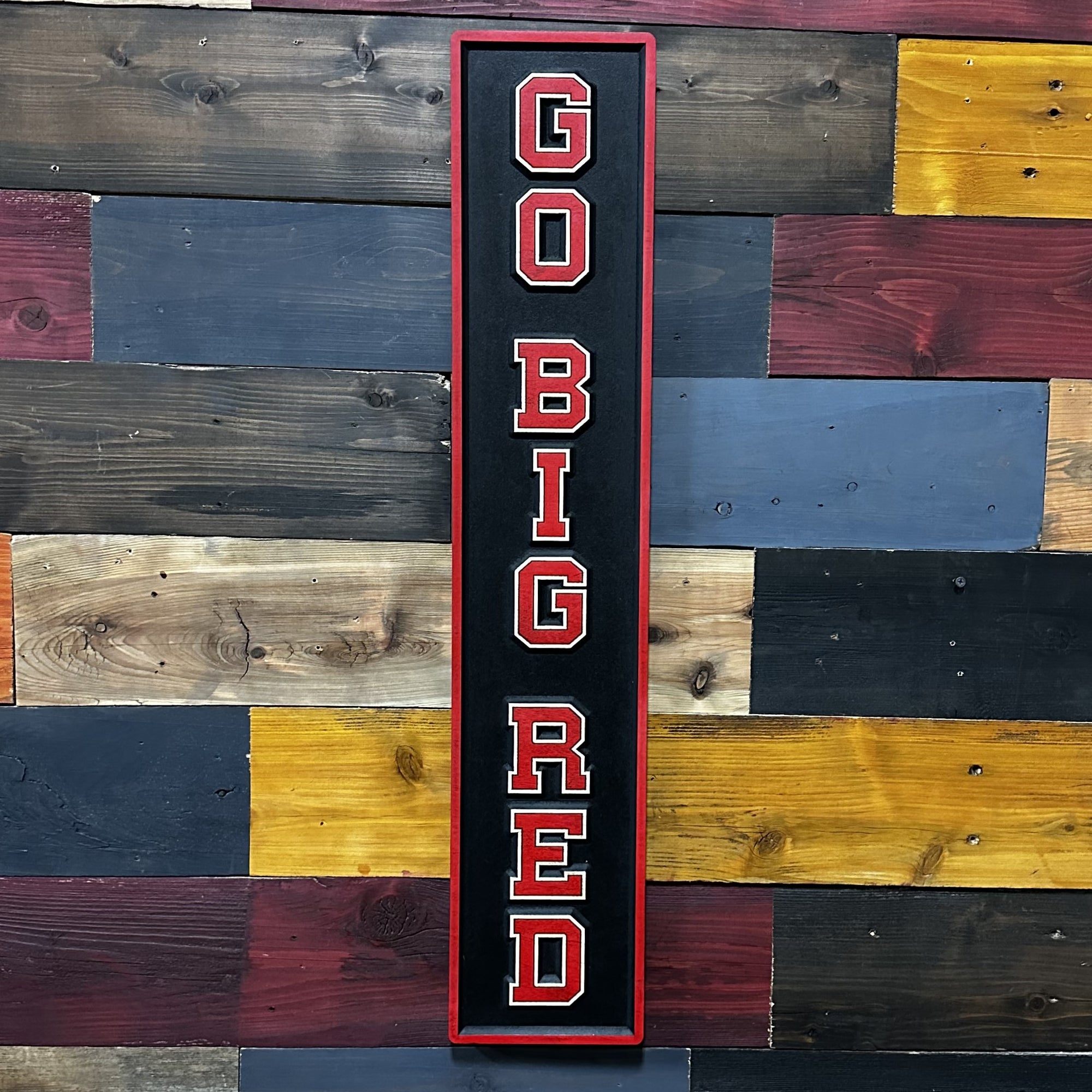 Close-up of carved Go Big Red Husker sports wood sign detail