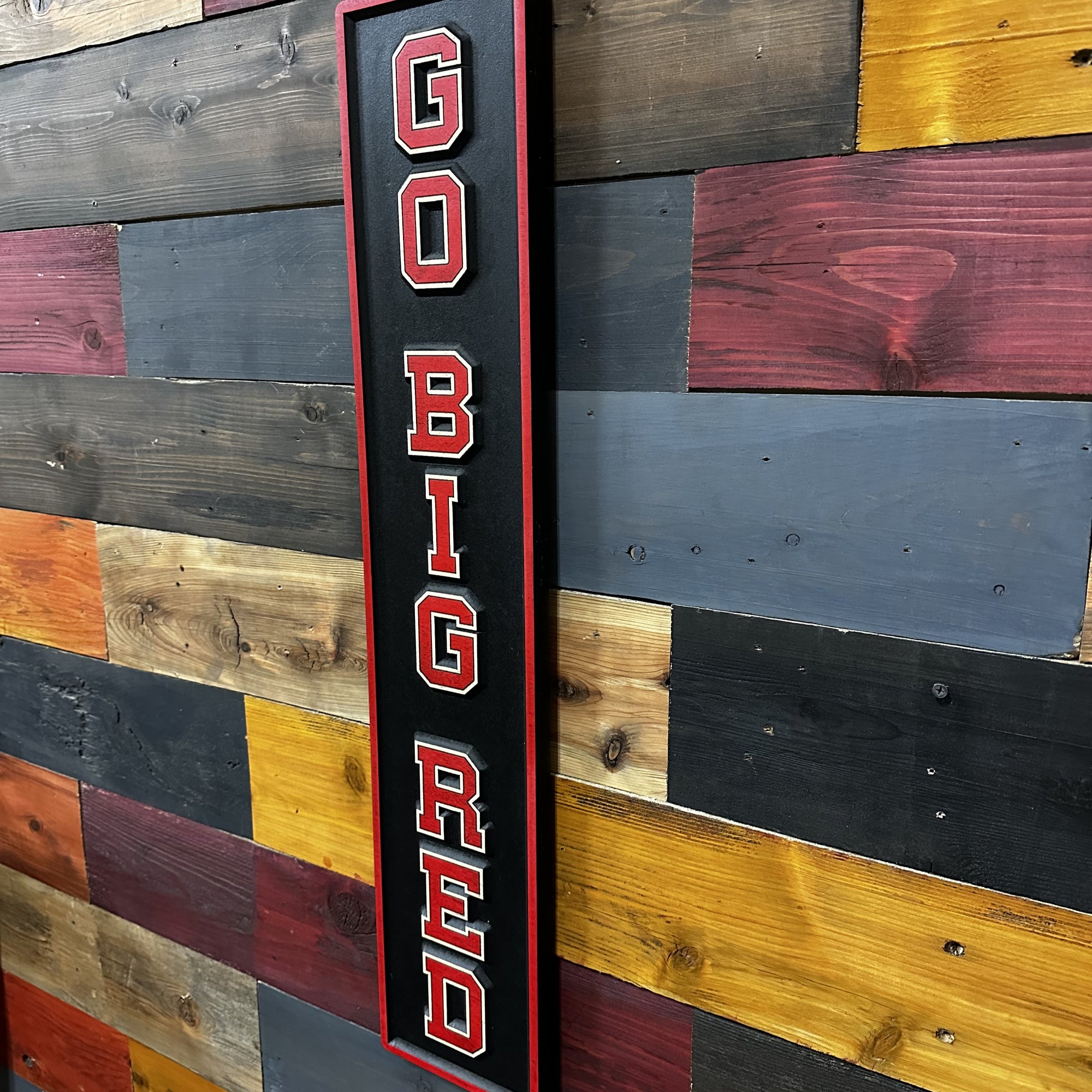 Side profile of Go Big Red Husker sports wood sign