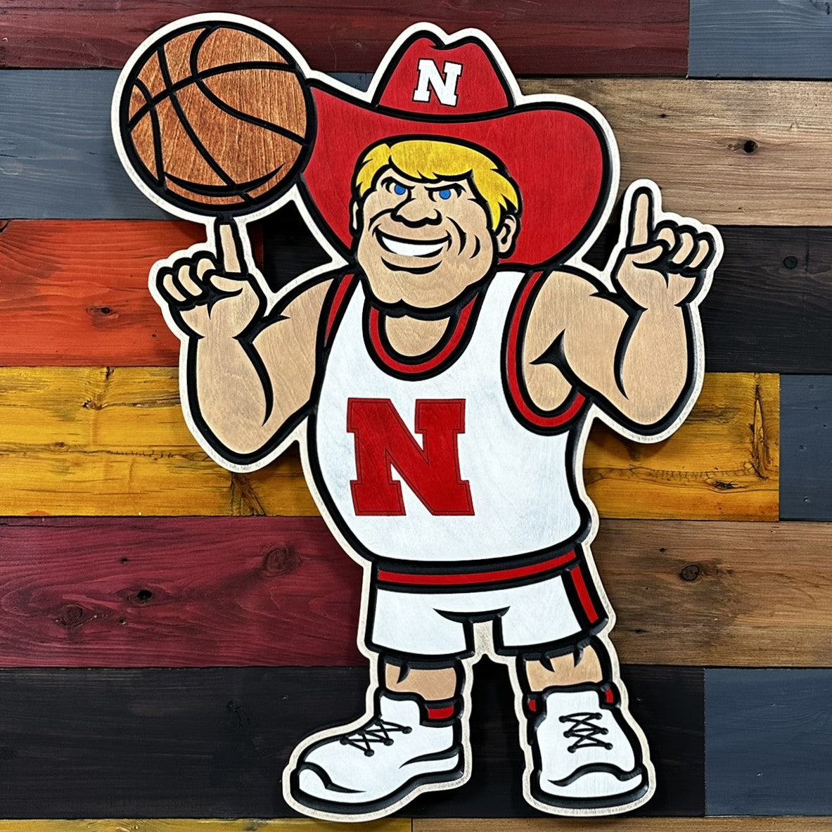 Close-up of carved Herbie Husker basketball wood sign detail