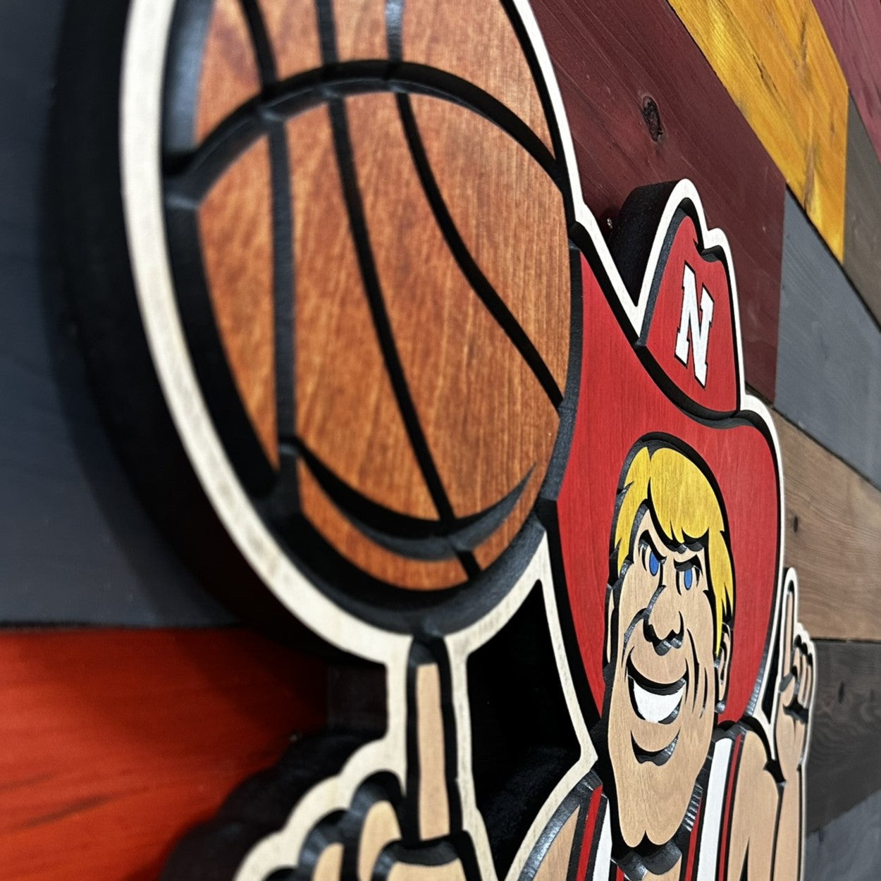 Herbie Husker basketball wood sign displayed on wall