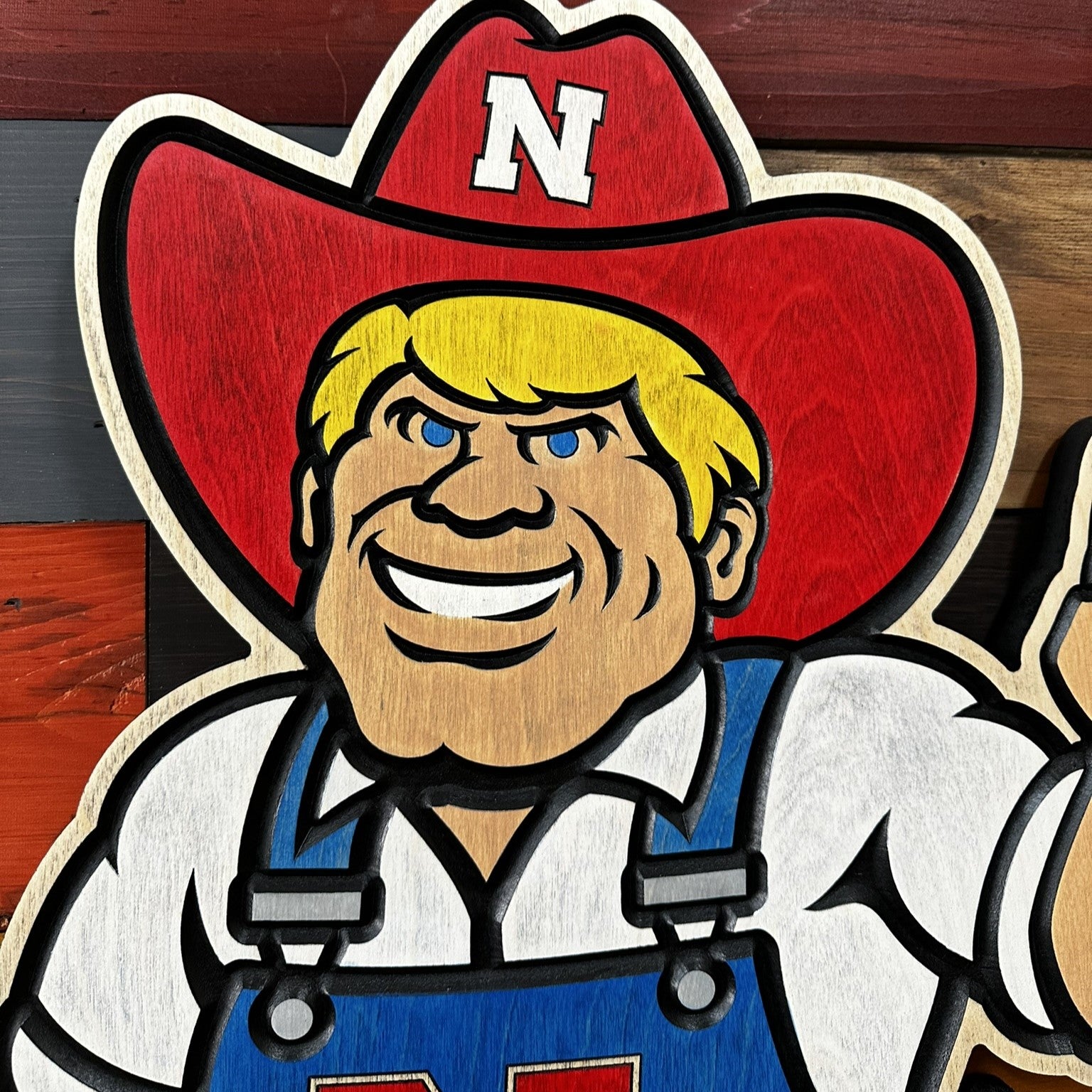 Angled view of Herbie Husker volleyball wood wall art