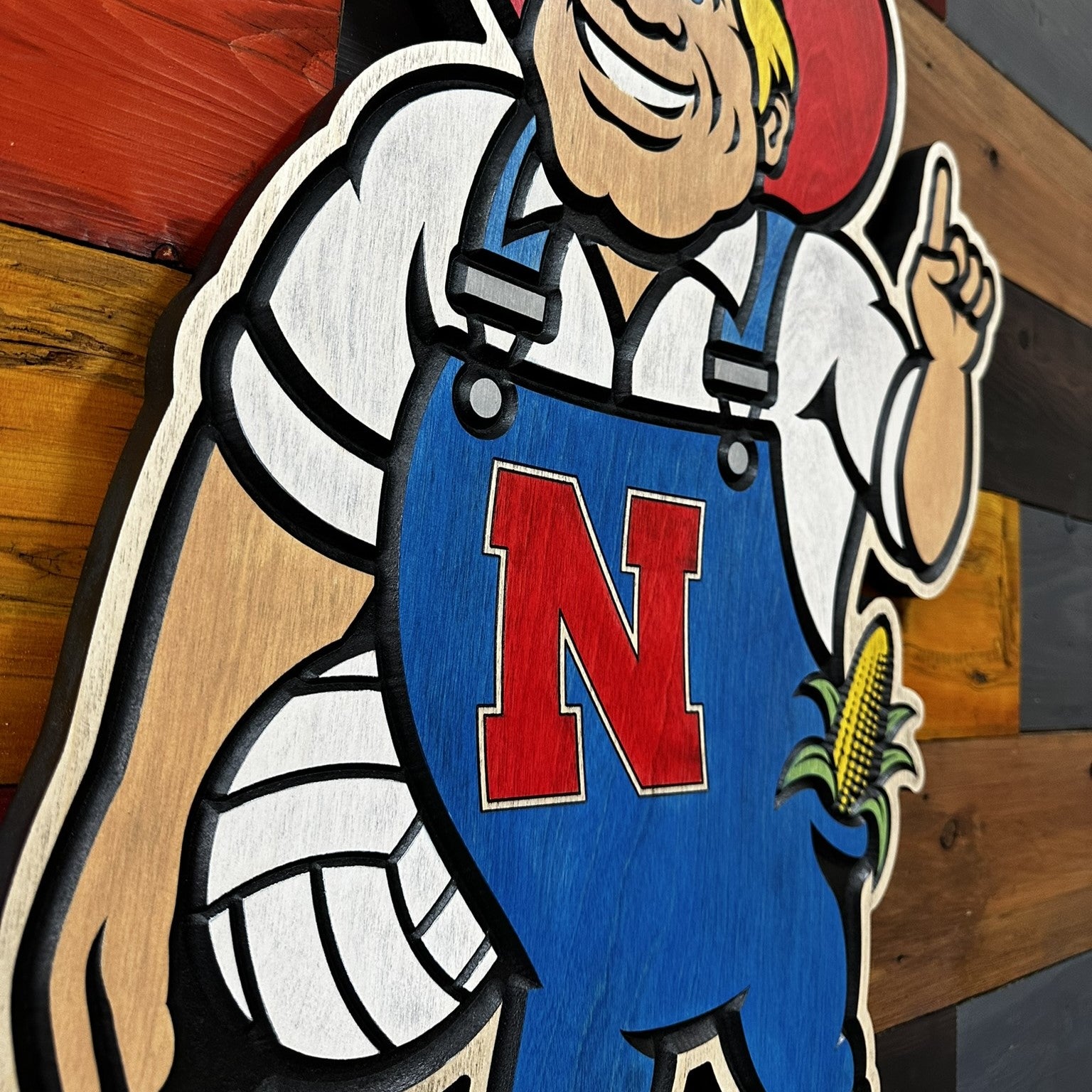 Detail view of carved Herbie Husker volleyball design