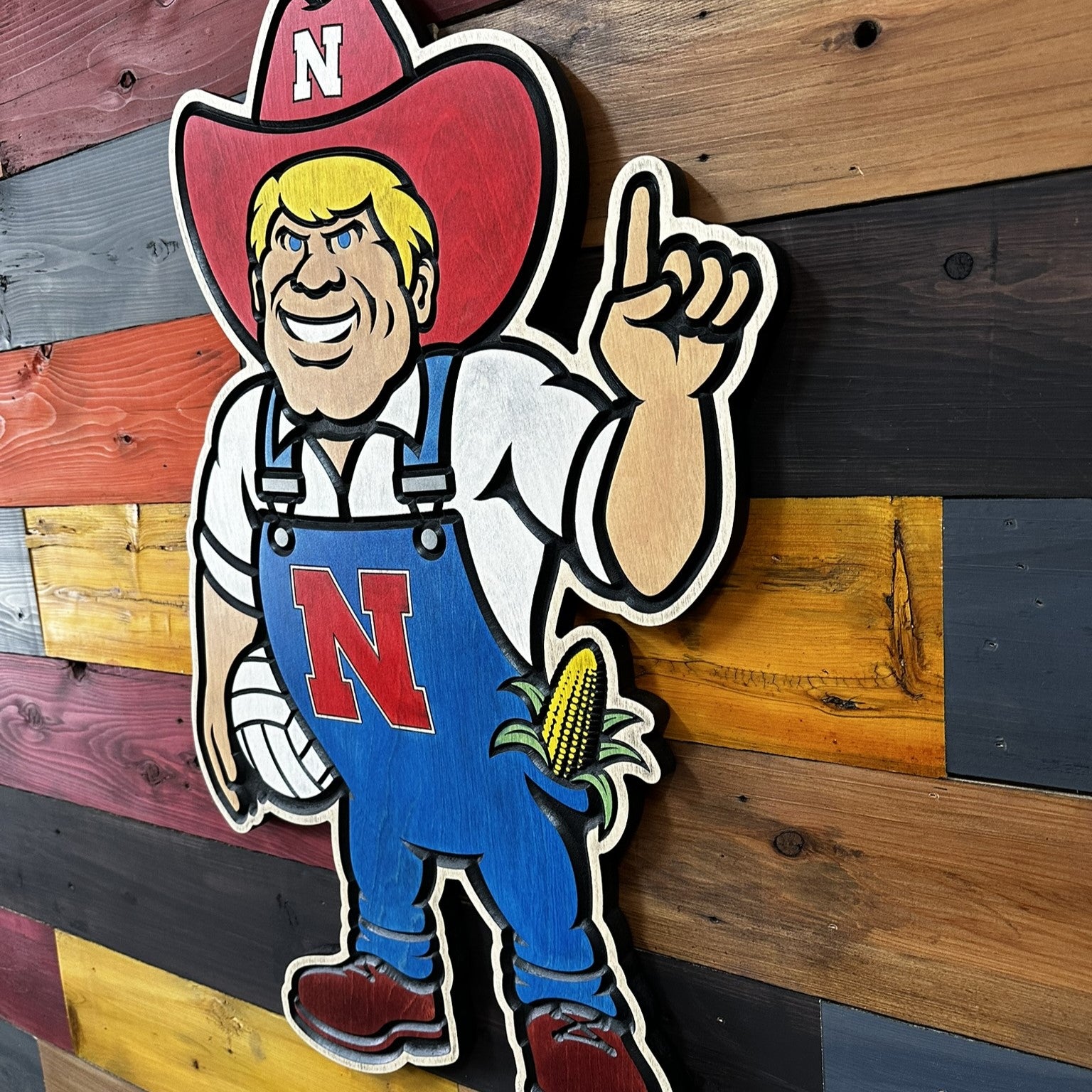 Side profile of Herbie Husker volleyball wood wall art