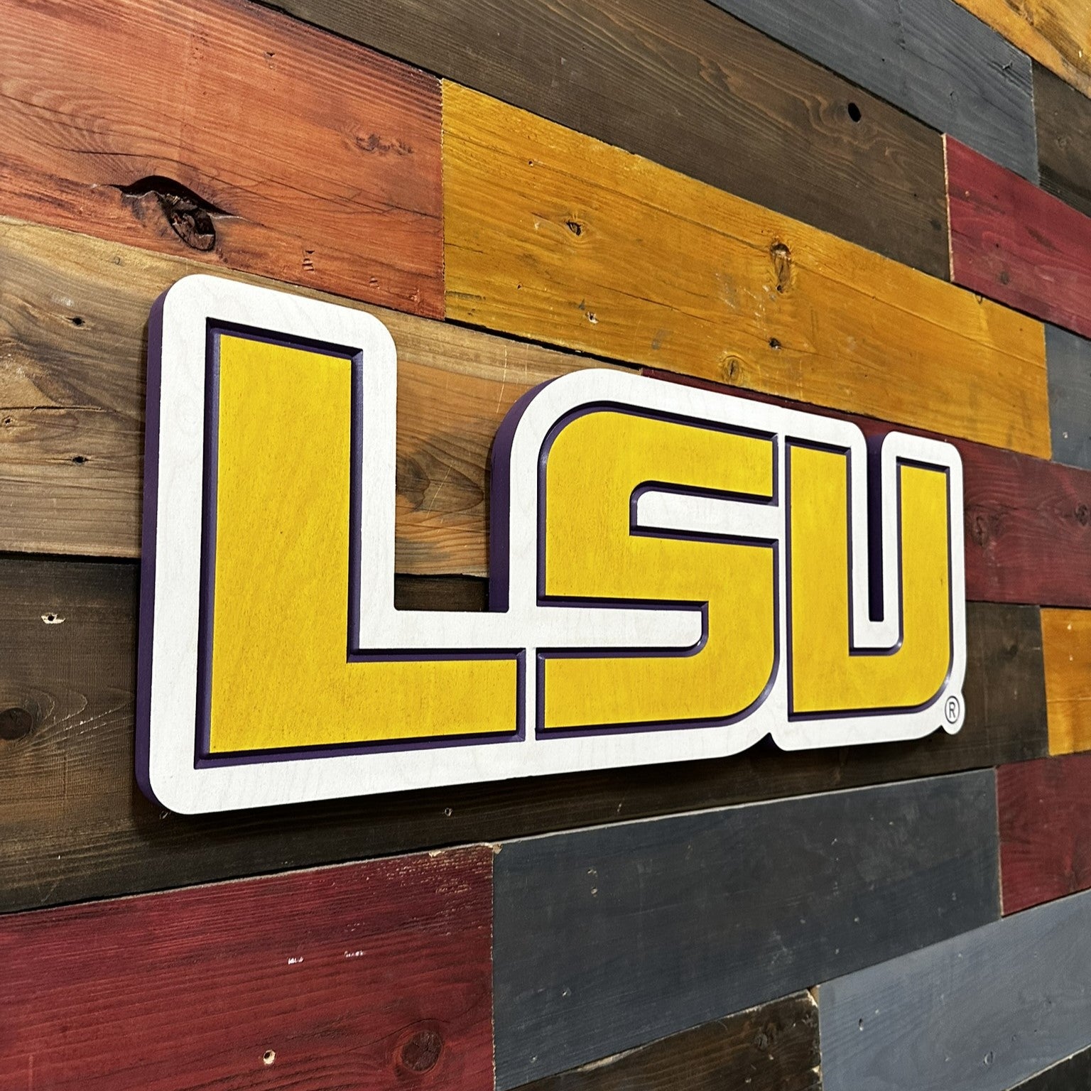 Side profile of horizontal LSU Tigers carved wood logo sign highlighting layered construction and dimensional carved depth detail