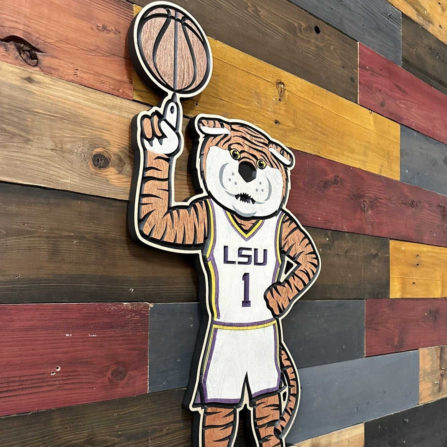 Official LSU basketball mascot wood sign featuring Mike the Tiger spinning a basketball on one finger