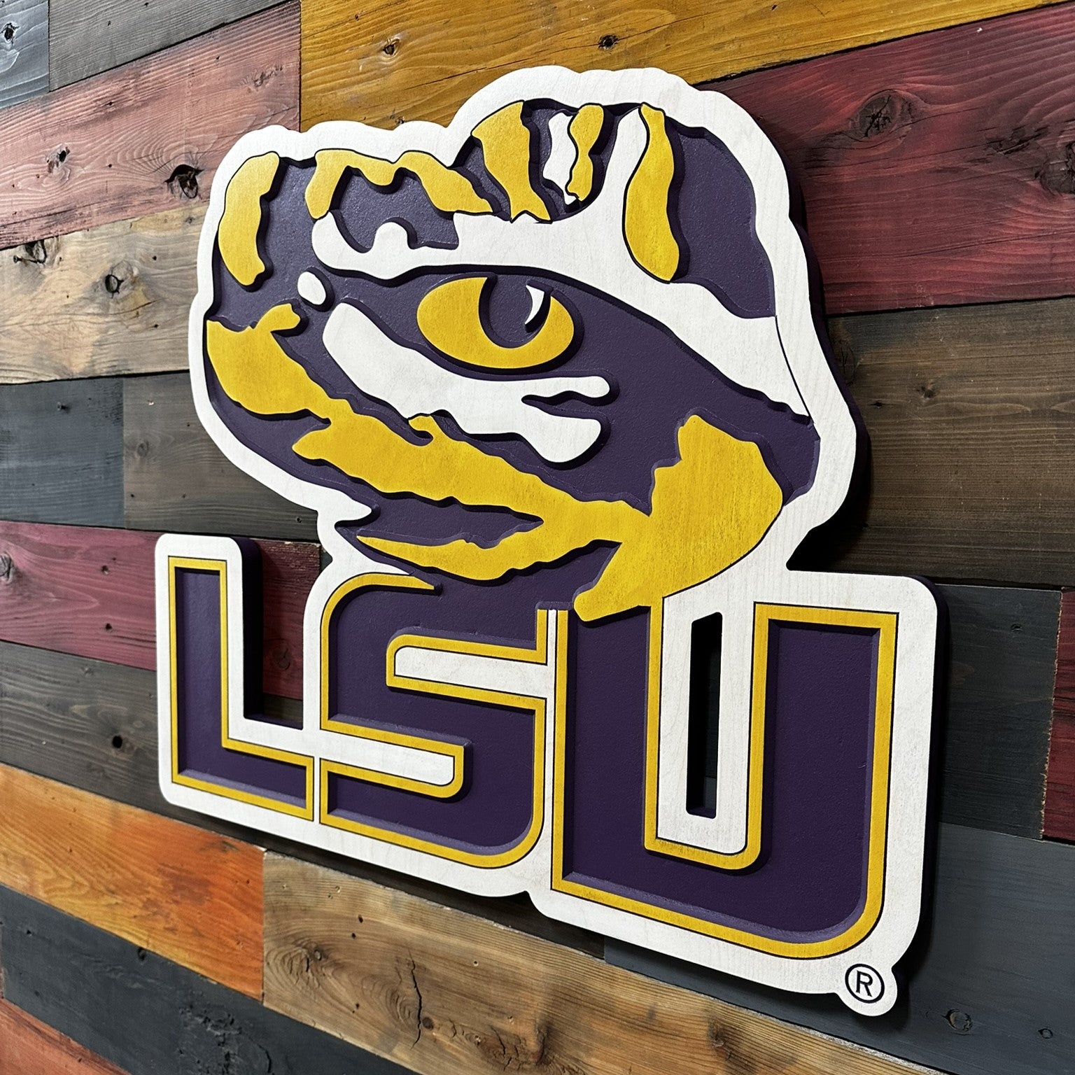 Close up detail of LSU Tiger Eye mascot artwork with layered carved paint lines and beveled dimensional texture