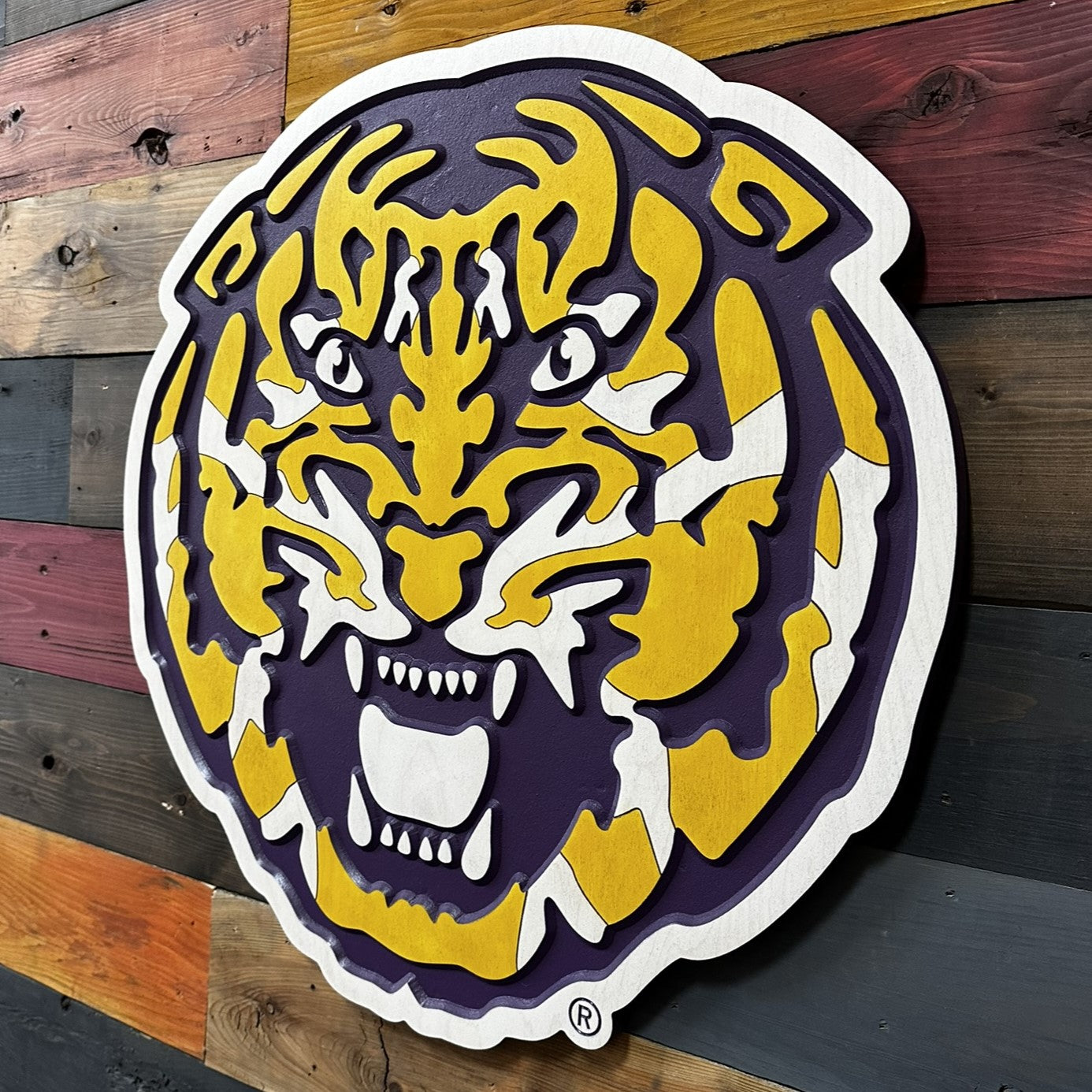 Close up detail of LSU Fighting Tiger Head carved artwork featuring layered tiger stripes and beveled dimensional texture