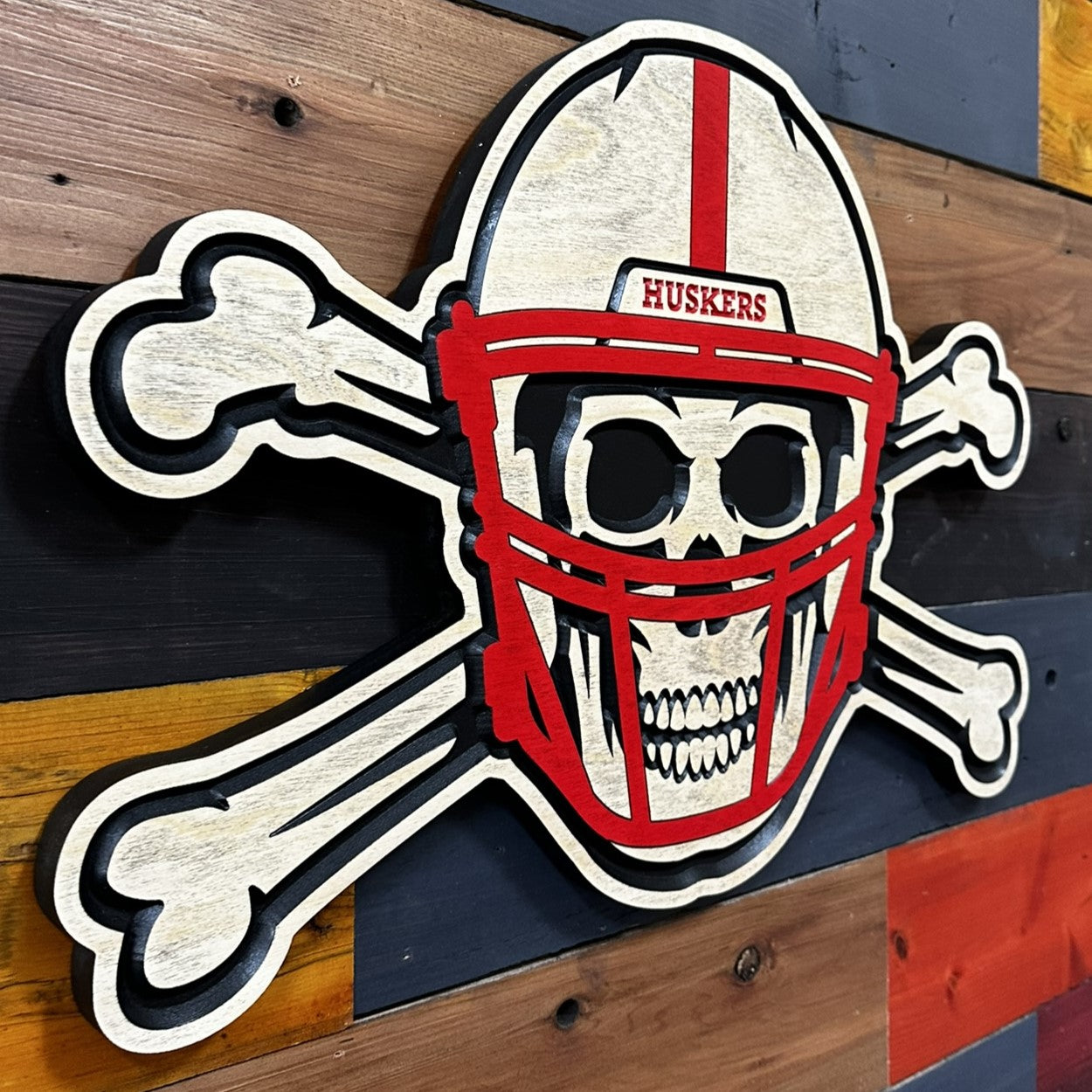Side profile of Nebraska Blackshirts skull and bones sign