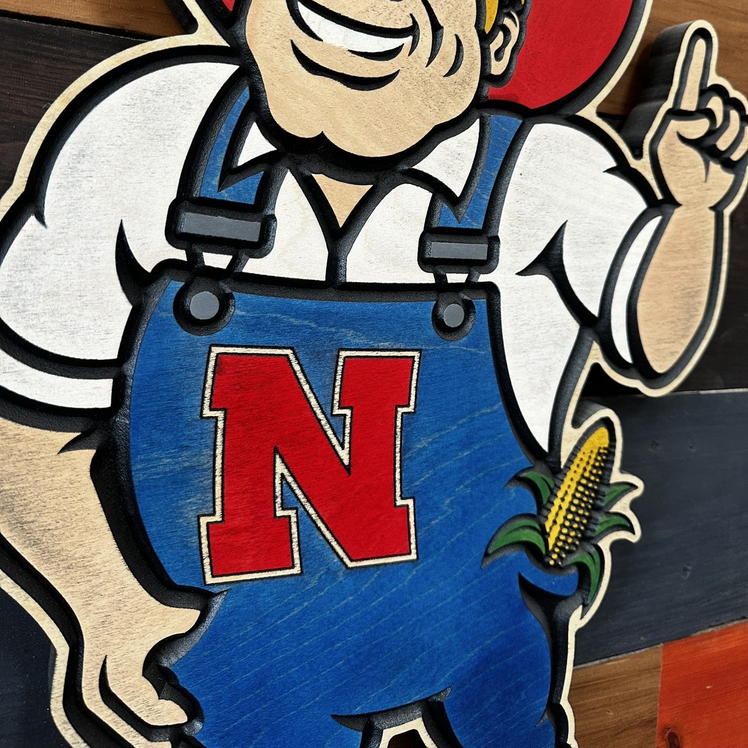 Side profile of Nebraska Cornhuskers Herbie Husker wood sign