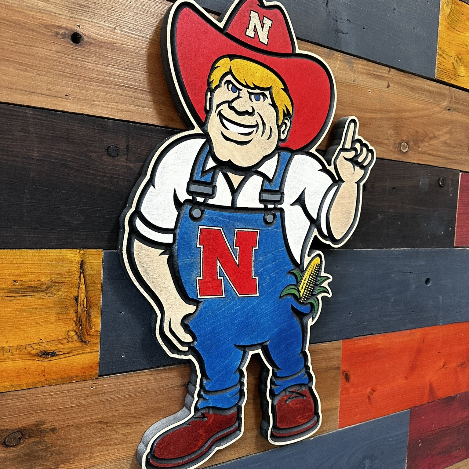 Nebraska Cornhuskers Herbie Husker wood sign displayed on wall