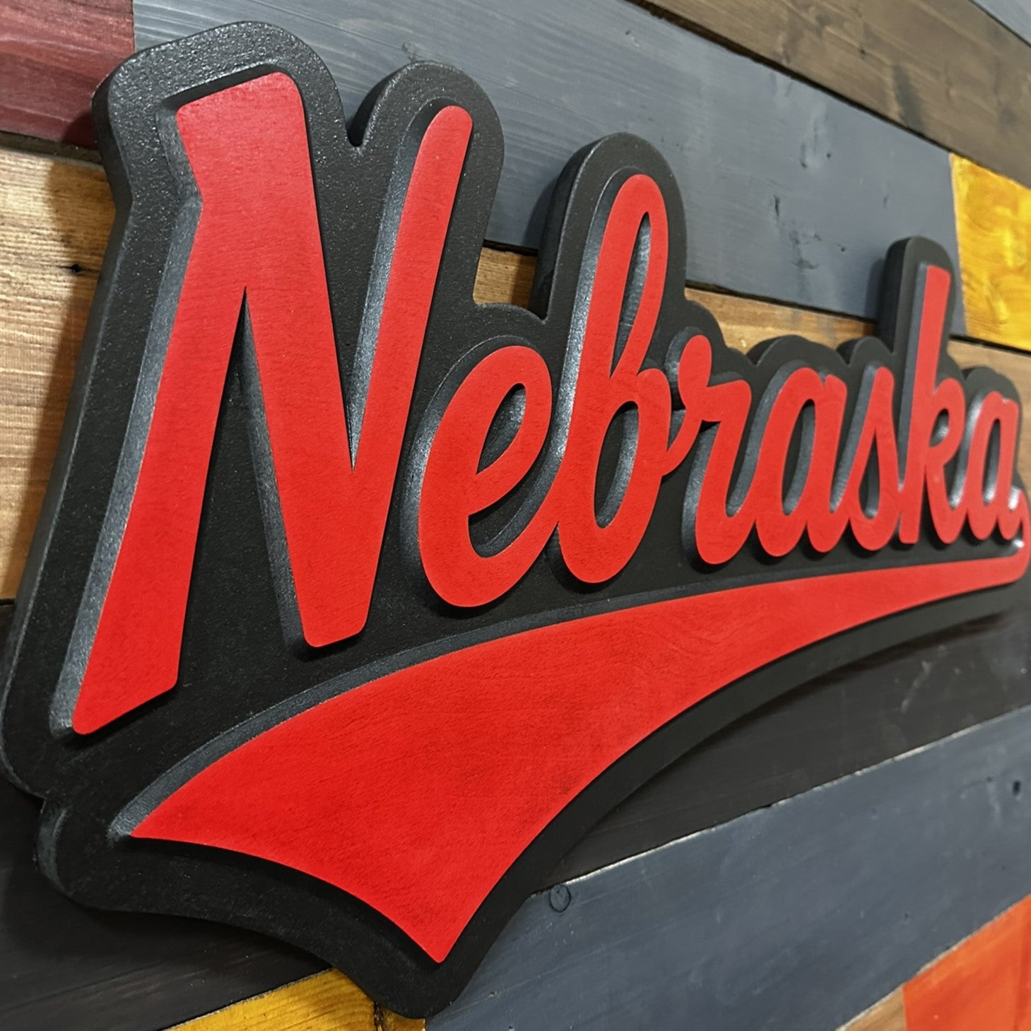 Close-up of Nebraska Cornhuskers jersey font wood sign detail