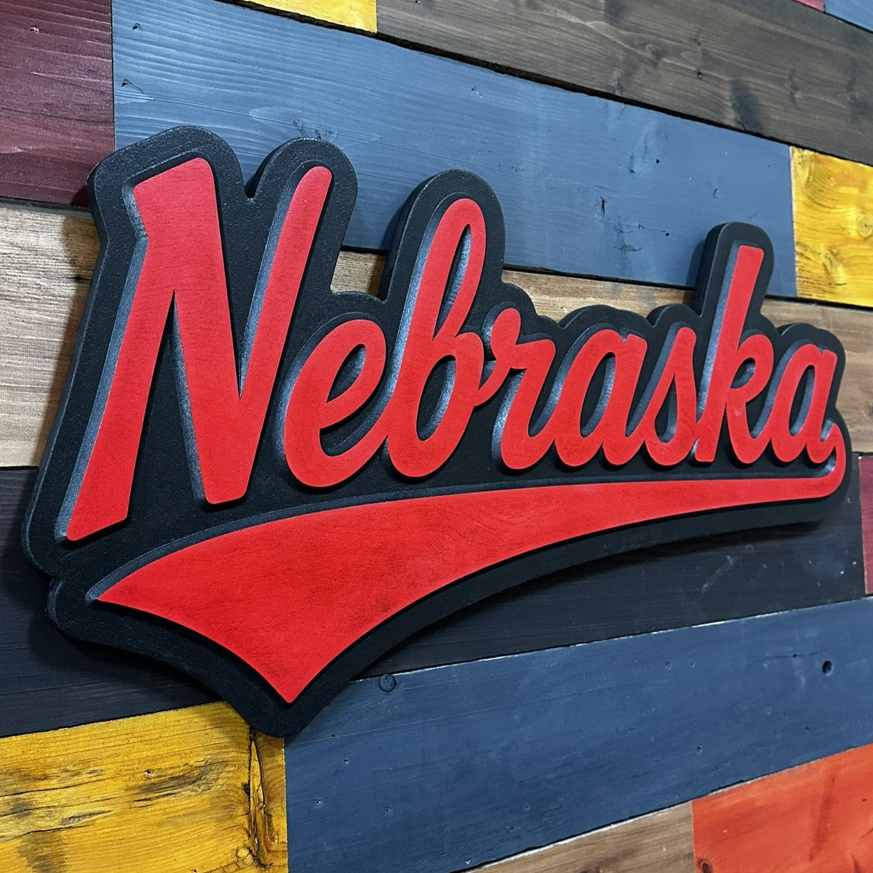 Side profile of Nebraska Cornhuskers jersey font wood sign