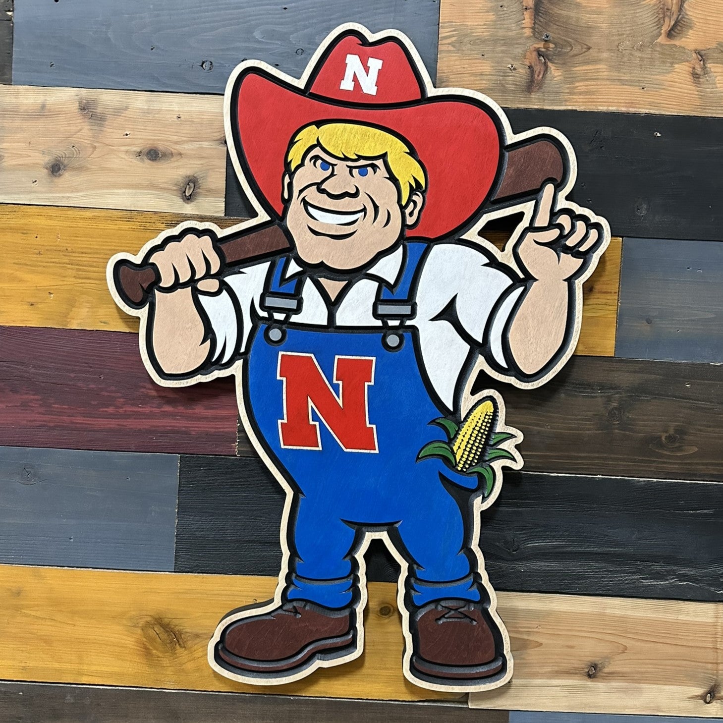 Close up of handcrafted Nebraska Herbie Husker baseball wood sign