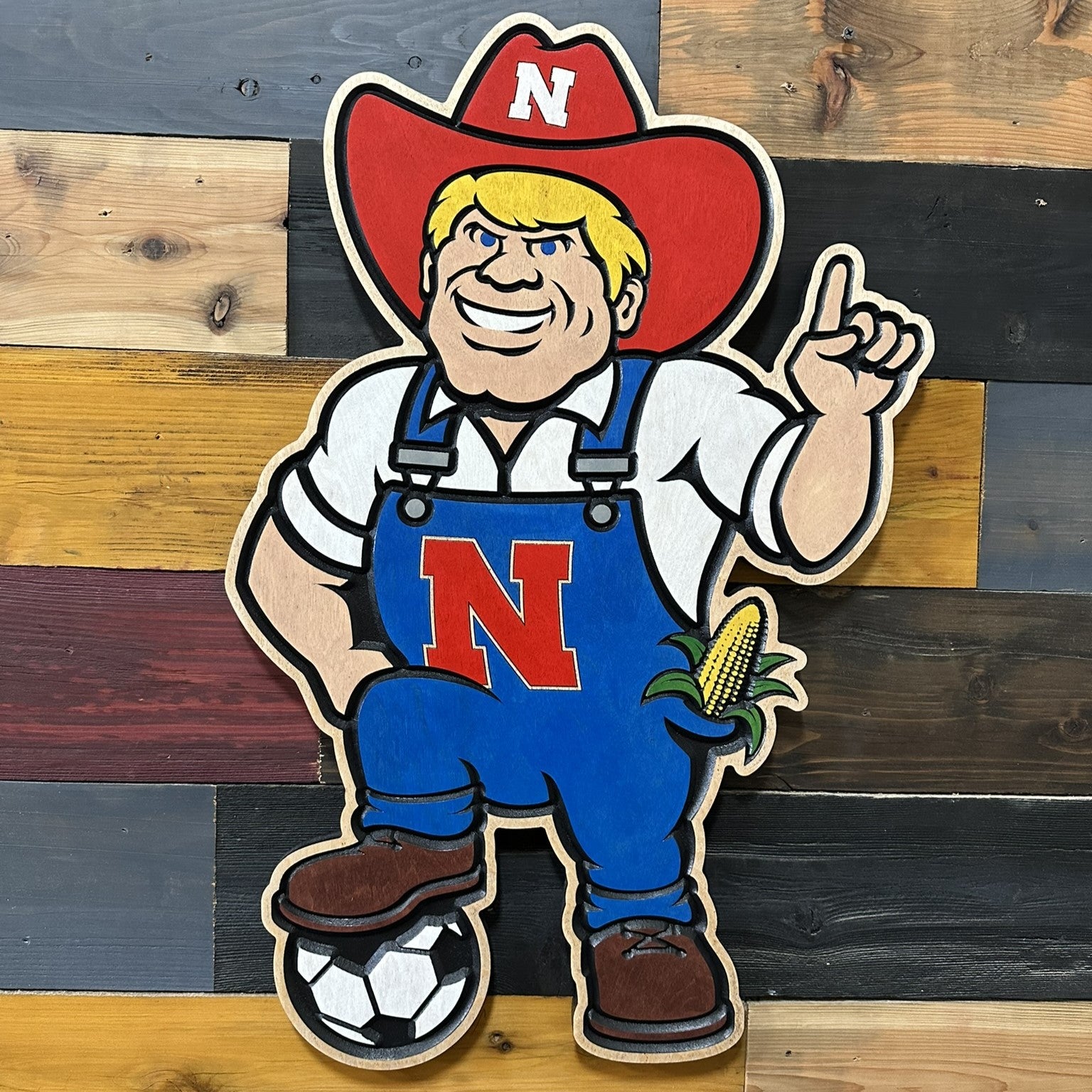 Nebraska soccer Herbie Husker wood sign displayed as Cornhuskers wall decor