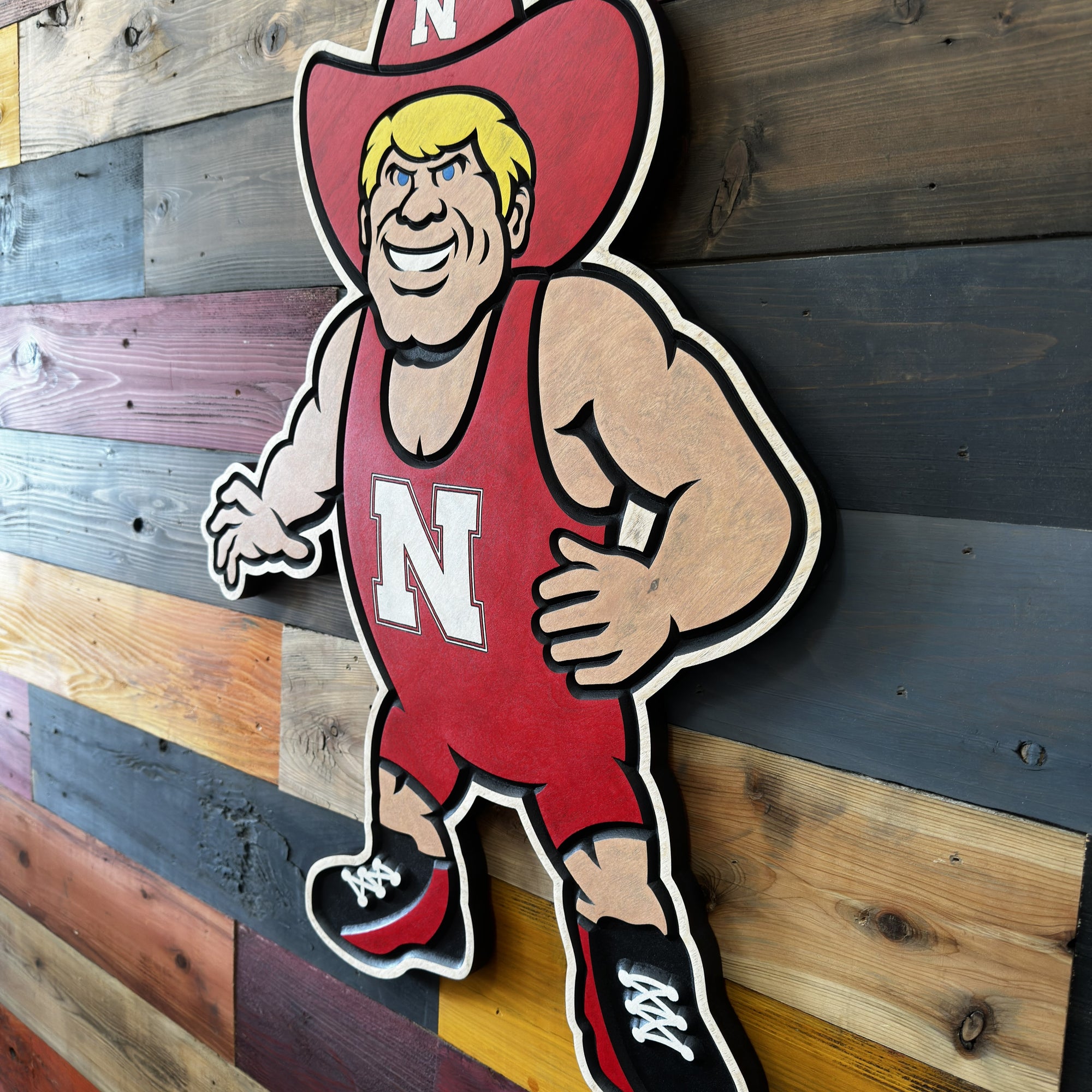 Nebraska wrestling Herbie Husker wood sign displayed as Cornhuskers wall decor