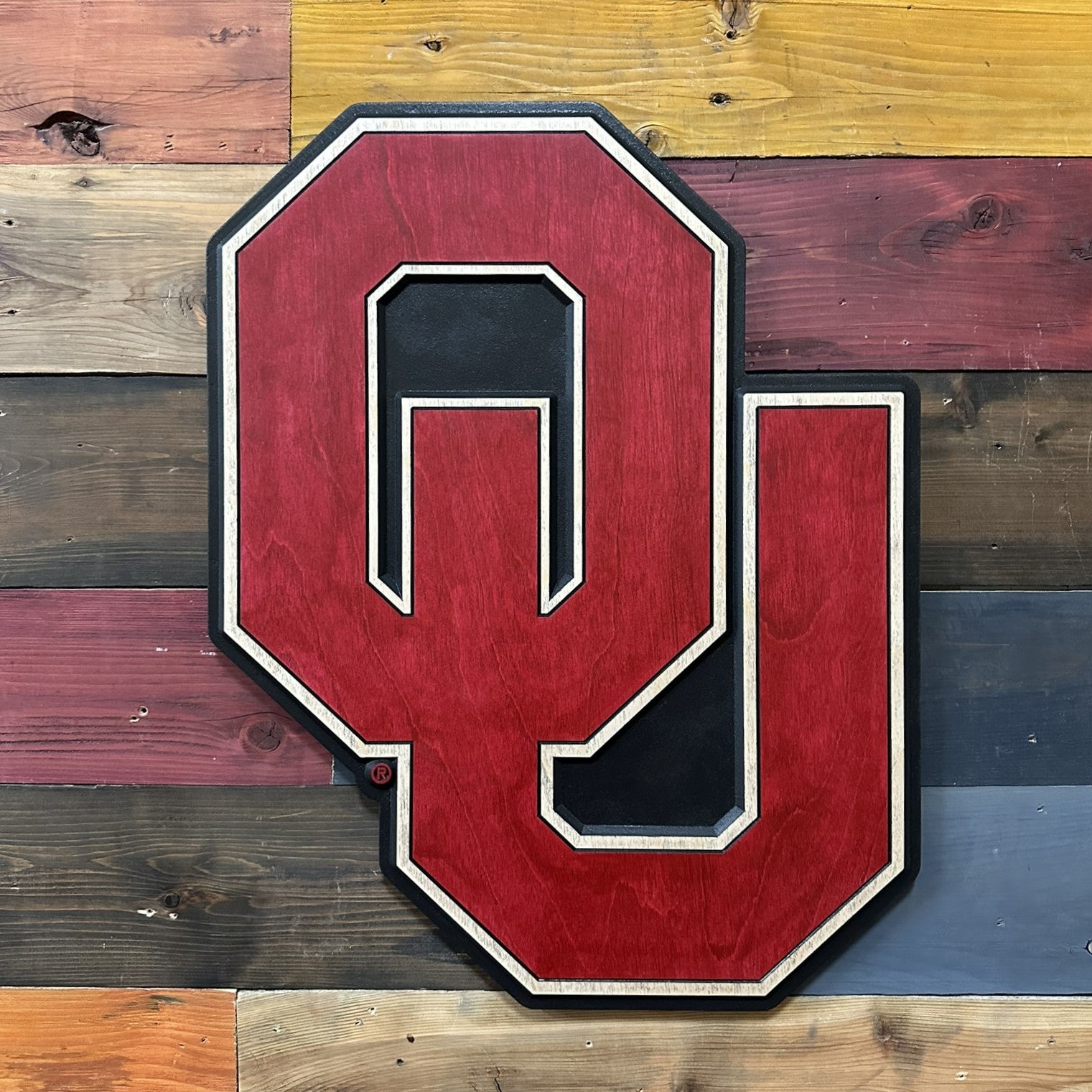 Handcrafted Oklahoma Sooners wall art featuring the official OU logo with layered CNC carved construction
