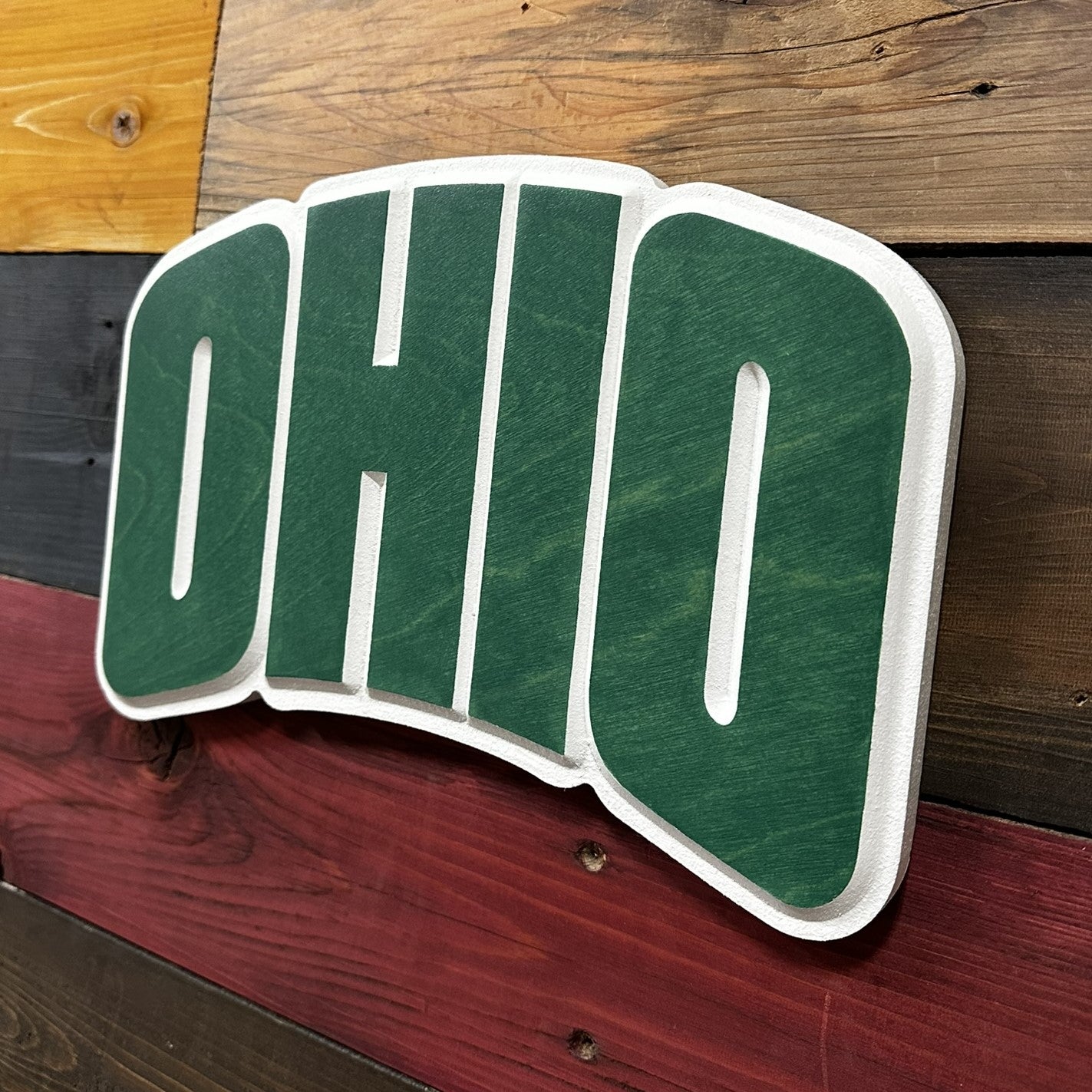 Side profile depth detail of handcrafted Ohio University Bobcats OHIO 3D carved wood sign
