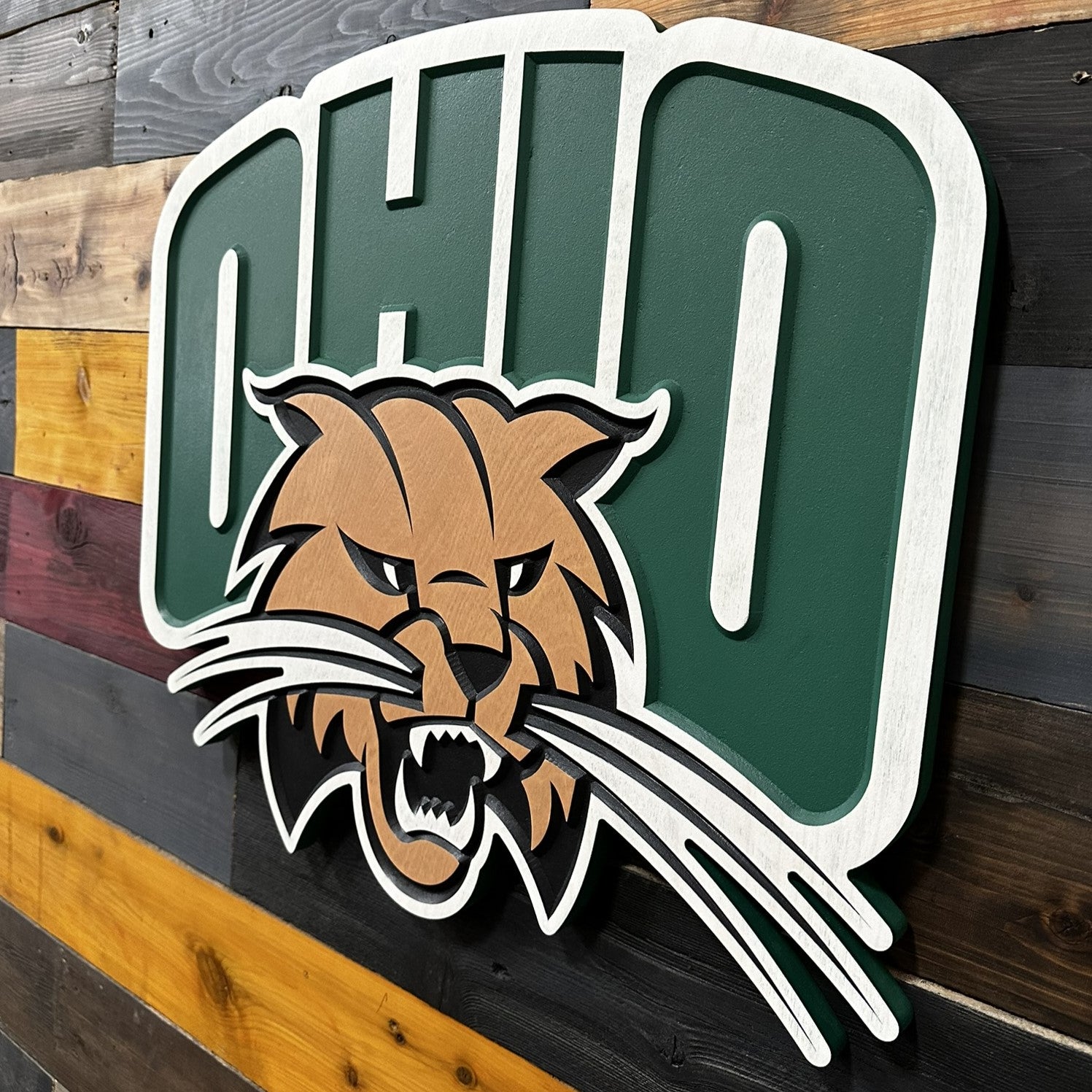 Side profile of Ohio University OHIO Rufus Bobcat carved wood sign highlighting layered construction and beveled depth detail