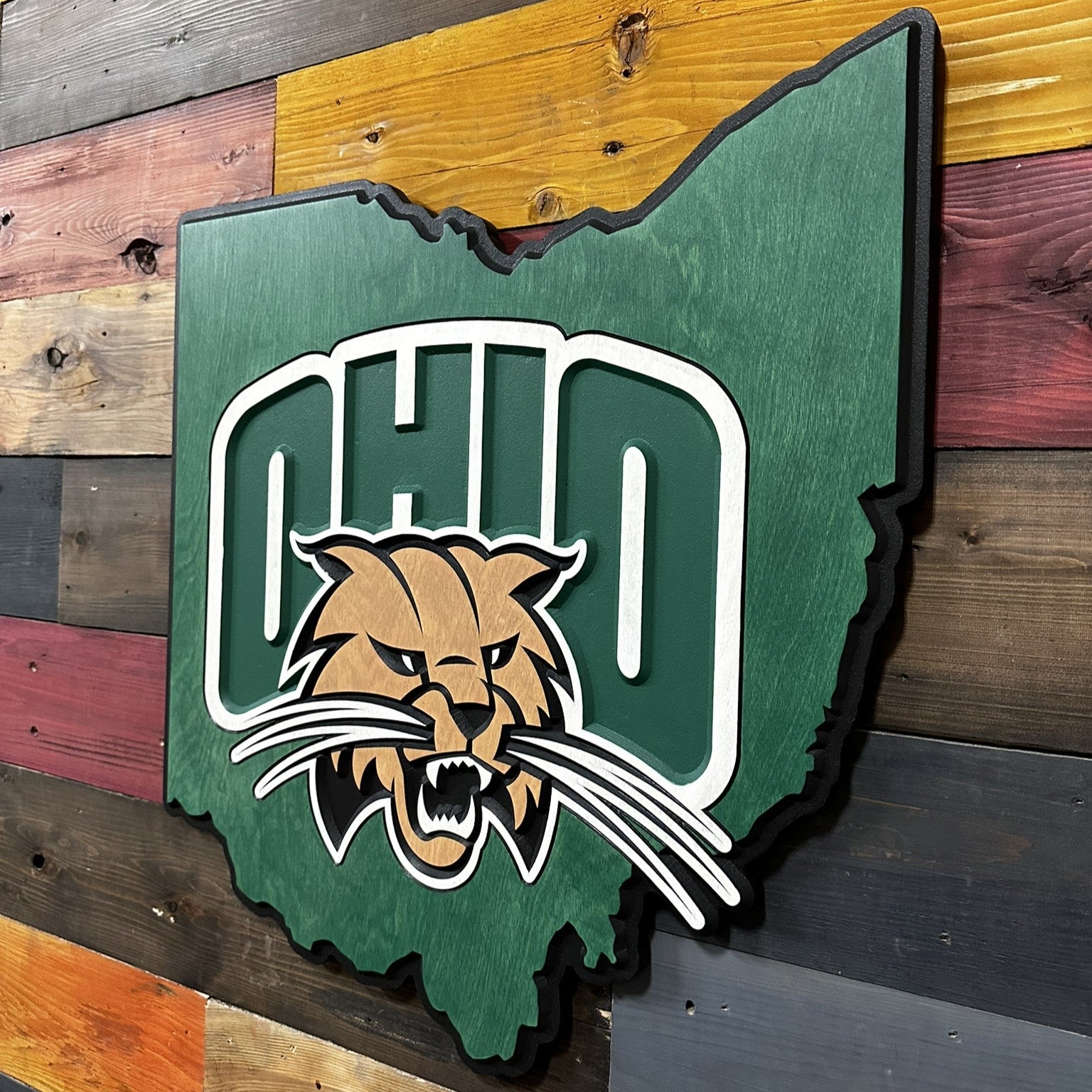 Side profile of Ohio University Ohio shaped carved wood sign showing layered construction and beveled dimensional thickness