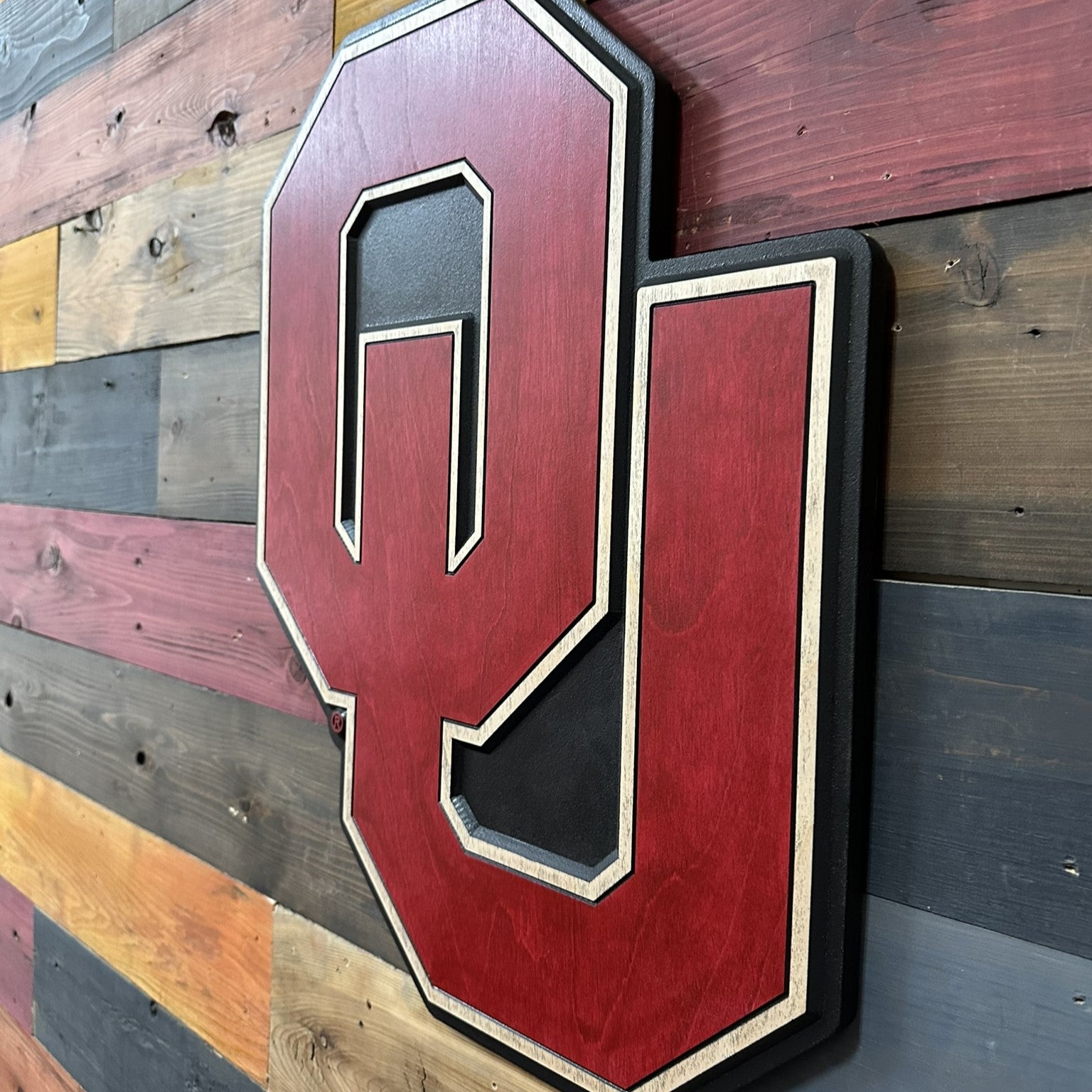 Oklahoma Sooners fan cave wall decor featuring the official OU logo handcrafted from premium wood