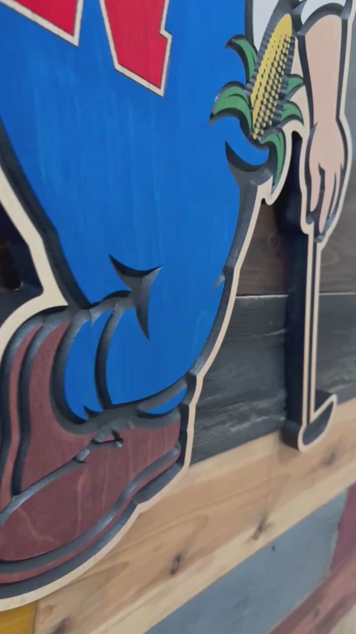 Video showing the carved and hand painted details of the officially licensed Herbie Husker golf wood sign