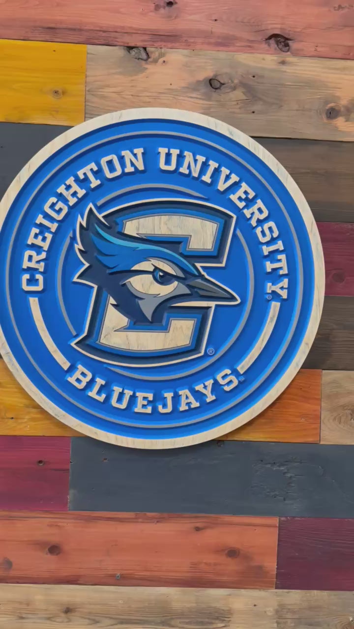 Video of Creighton Bluejays round full logo wood sign