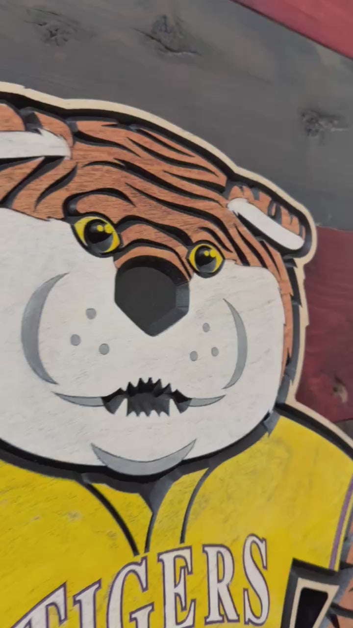 Take a closer look at our officially licensed LSU Mike the Tiger Baseball Wood Sign. Precision CNC carved, hand-painted, and handcrafted in Nebraska, this unique wall art features Mike the Tiger in a Tigers baseball jersey and is perfect for LSU baseball fans, alumni, and collectors.